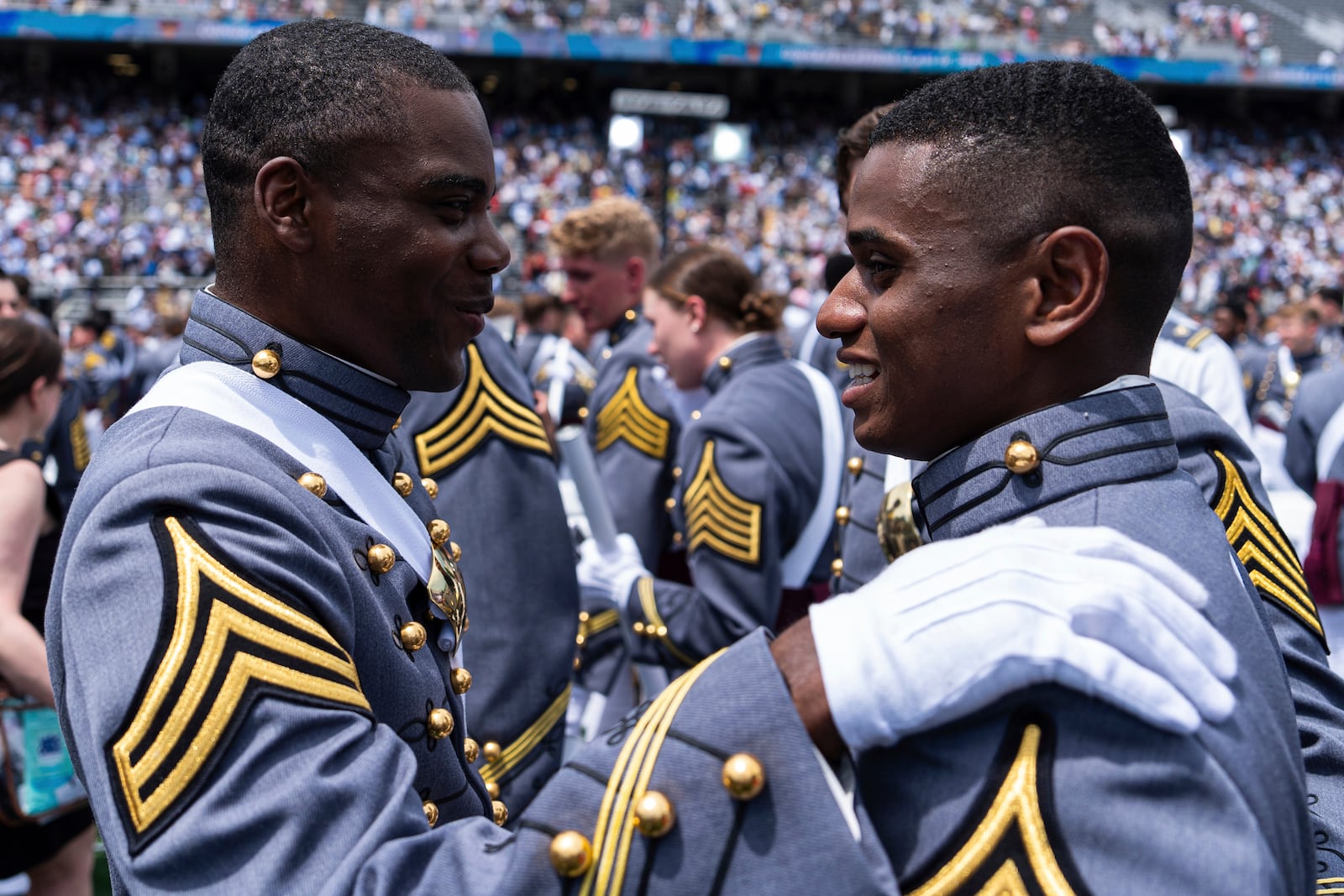 FILE - West Point graduates hug at the conclusion of the U.S. Military Academy commencement ceremony at Michie Stadium on Saturday, May 25, 2024, in West Point, N.Y. (AP Photo/Julia Nikhinson, File)