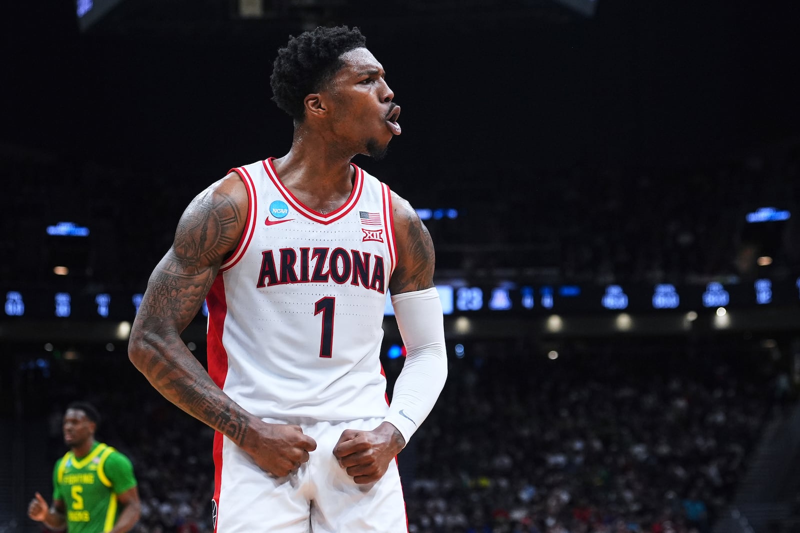 Arizona guard Caleb Love reacts during the first half against Oregon in the second round of the NCAA college basketball tournament, Sunday, March 23, 2025 in Seattle. (AP Photo/Lindsey Wasson)