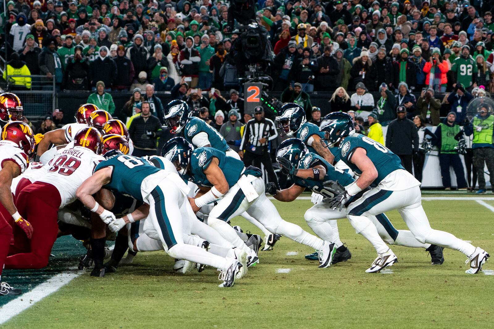 FILE - Philadelphia Eagles quarterback Jalen Hurts, center, and teammates run the tush push play during the NFL championship playoff football game against the Washington Commanders, Sunday, Jan. 26, 2025, in Philadelphia. (AP Photo/Chris Szagola, FIle)