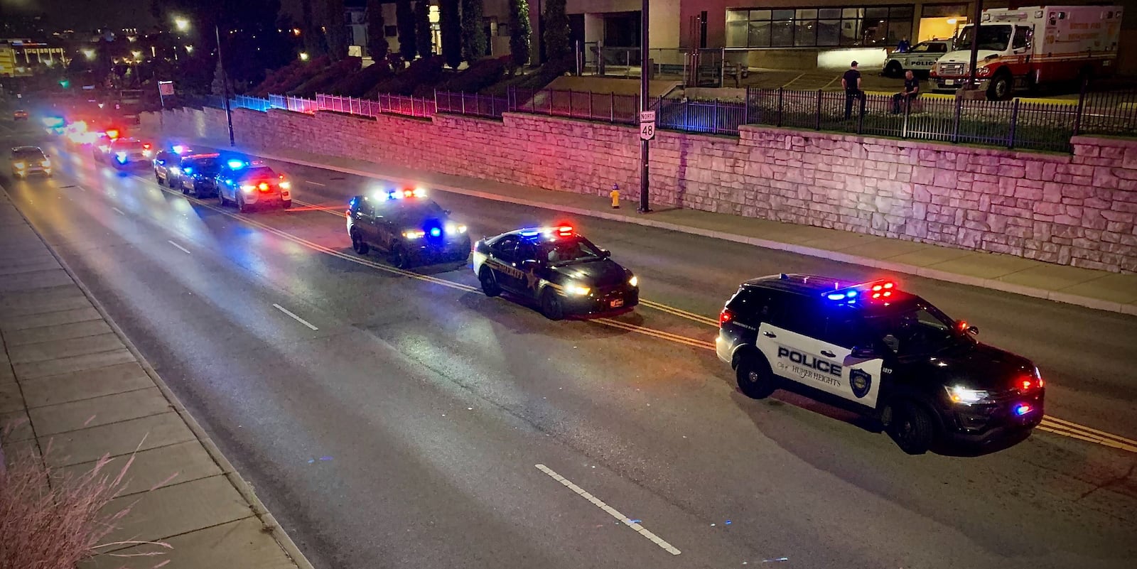 Police cruisers lined up outside Miami Valley Hospital. MARSHALL GORBY \STAFF