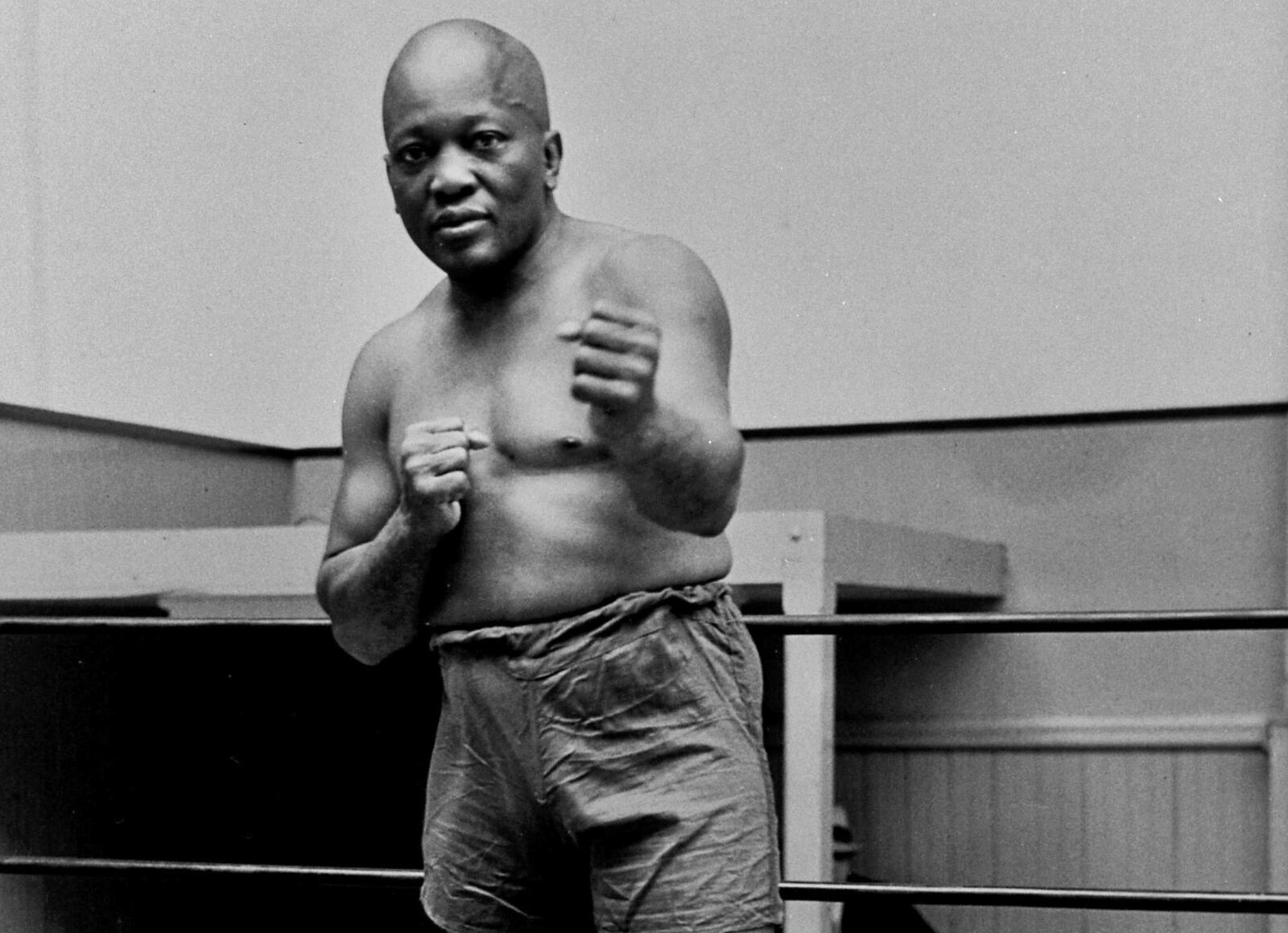 FILE - In this 1932 file photo, boxer Jack Johnson, the first black world heavyweight champion, poses in New York City. Black athletes have been finding a way to fight for social change for more than 100 years, from Jack Johnson, to Muhammad Ali to Kaepernick. (AP Photo/File)