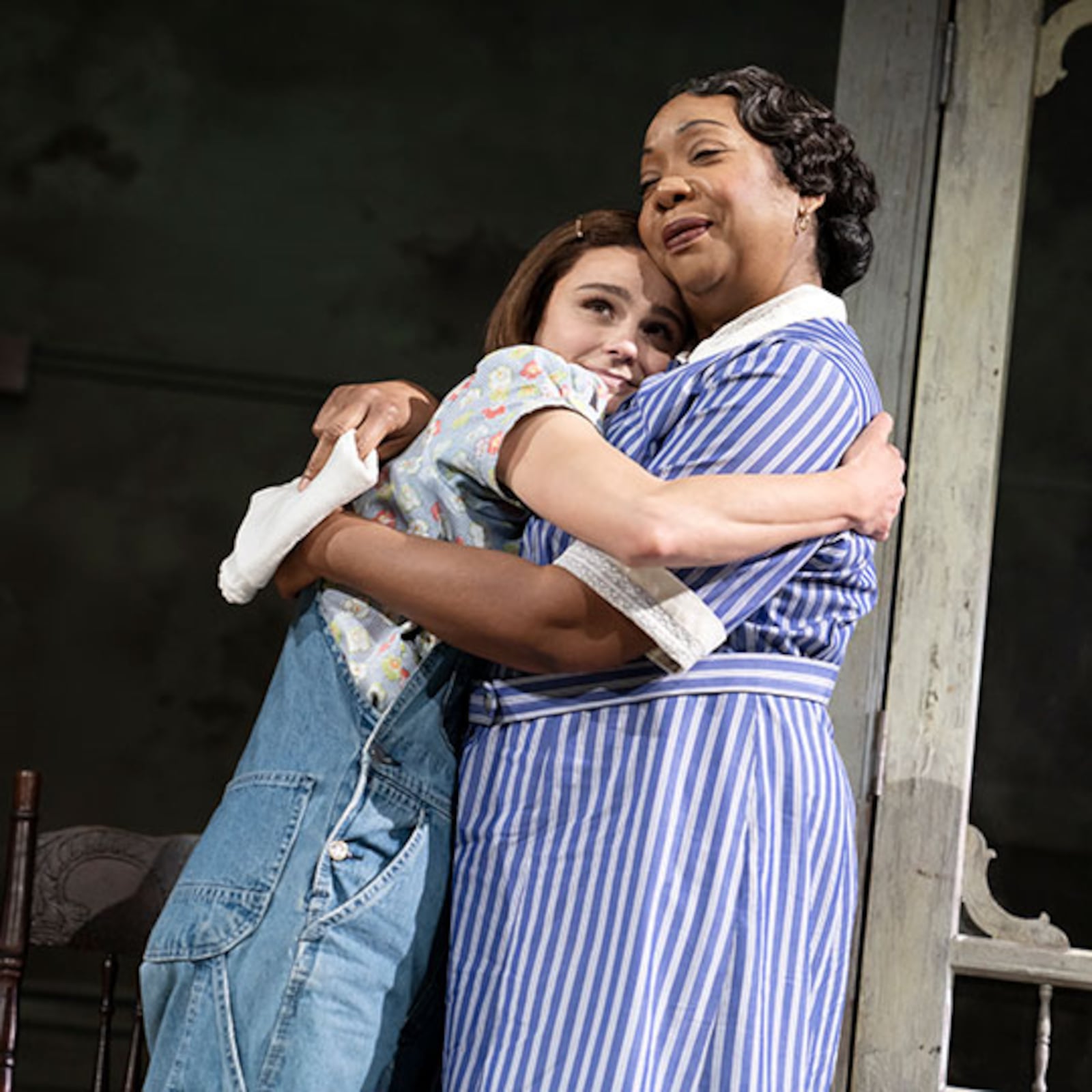 Atticus Finch's young daughter, Scout, portrayed by Melanie Moore embraces the family's Black housekeeper, Calpurnia, who is portrayed by Jacqueline Williams. CONTRIBUTED