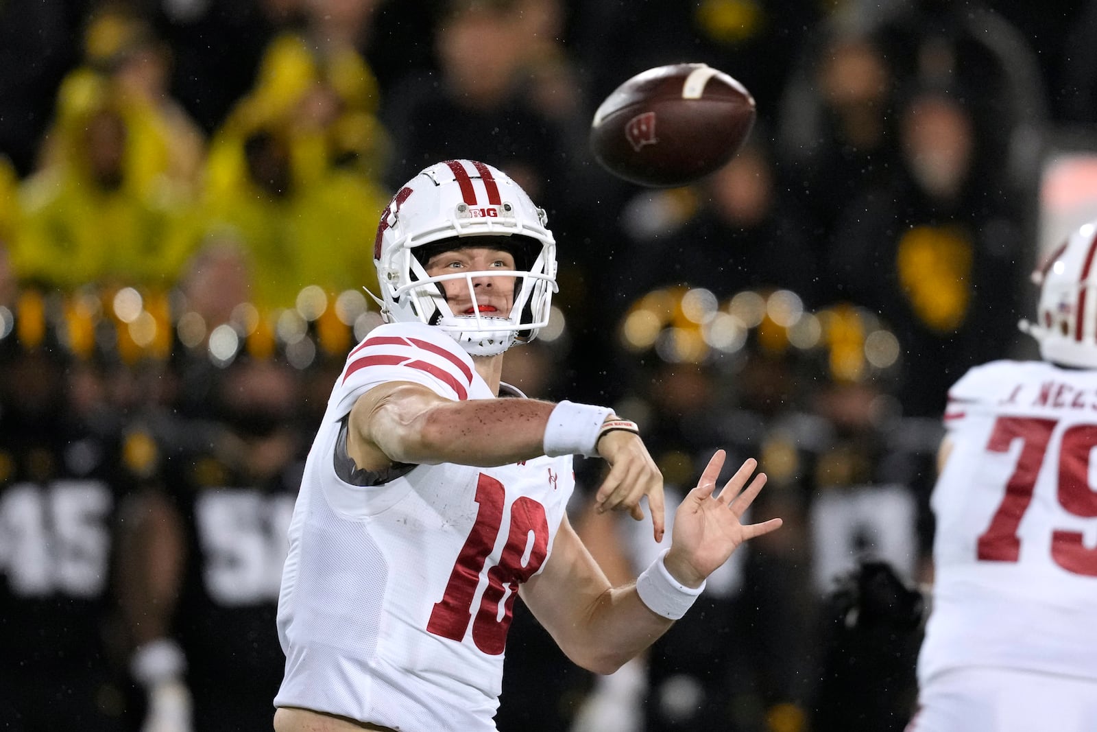 Wisconsin quarterback Braedyn Locke (18) throws a pass during the second half of an NCAA college football game against Iowa, Saturday, Nov. 2, 2024, in Iowa City, Iowa. Iowa won 42-10. (AP Photo/Charlie Neibergall)