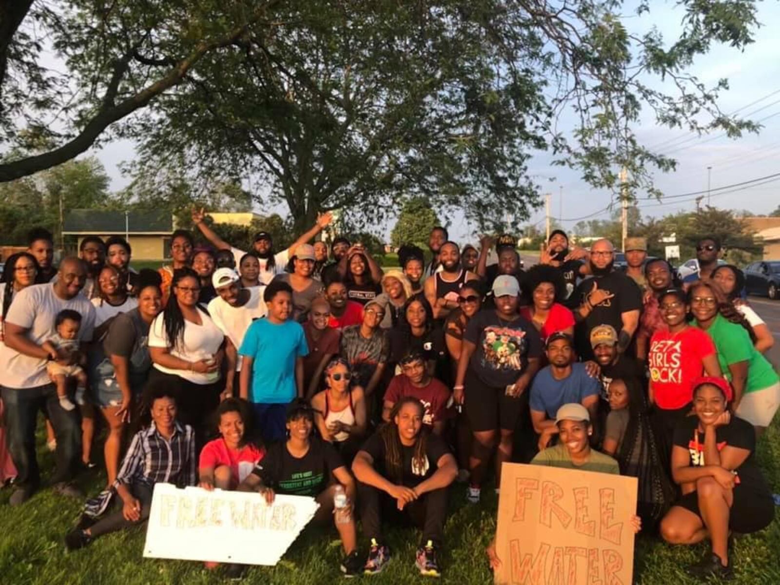 Daj’za Demmings ( arms crossed front row) is the president of Dayton Young Black Professionals.