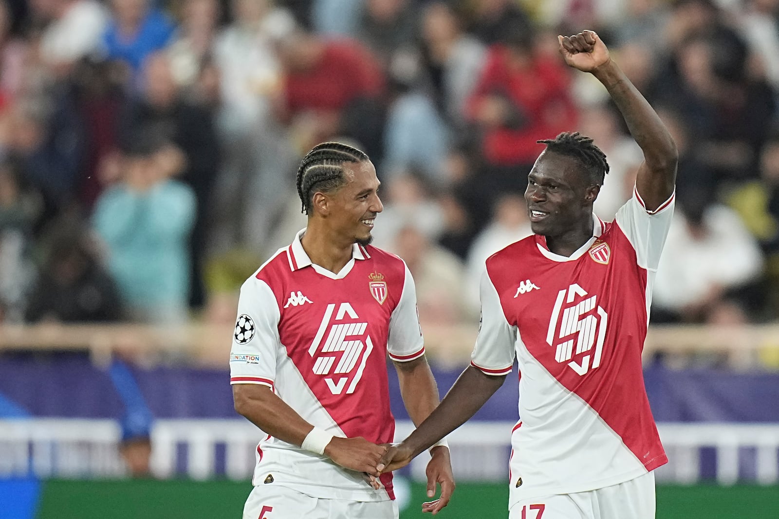 Monaco's Wilfried Singo, right, celebrates with his teammate after scoring the third goal during the Champions League opening phase soccer match between Monaco and Crvena Zvezda, Red Star Belgrade, at the Louis II stadium, in Monaco, Tuesday, Oct. 22, 2024. (AP Photo/Laurent Cipriani)