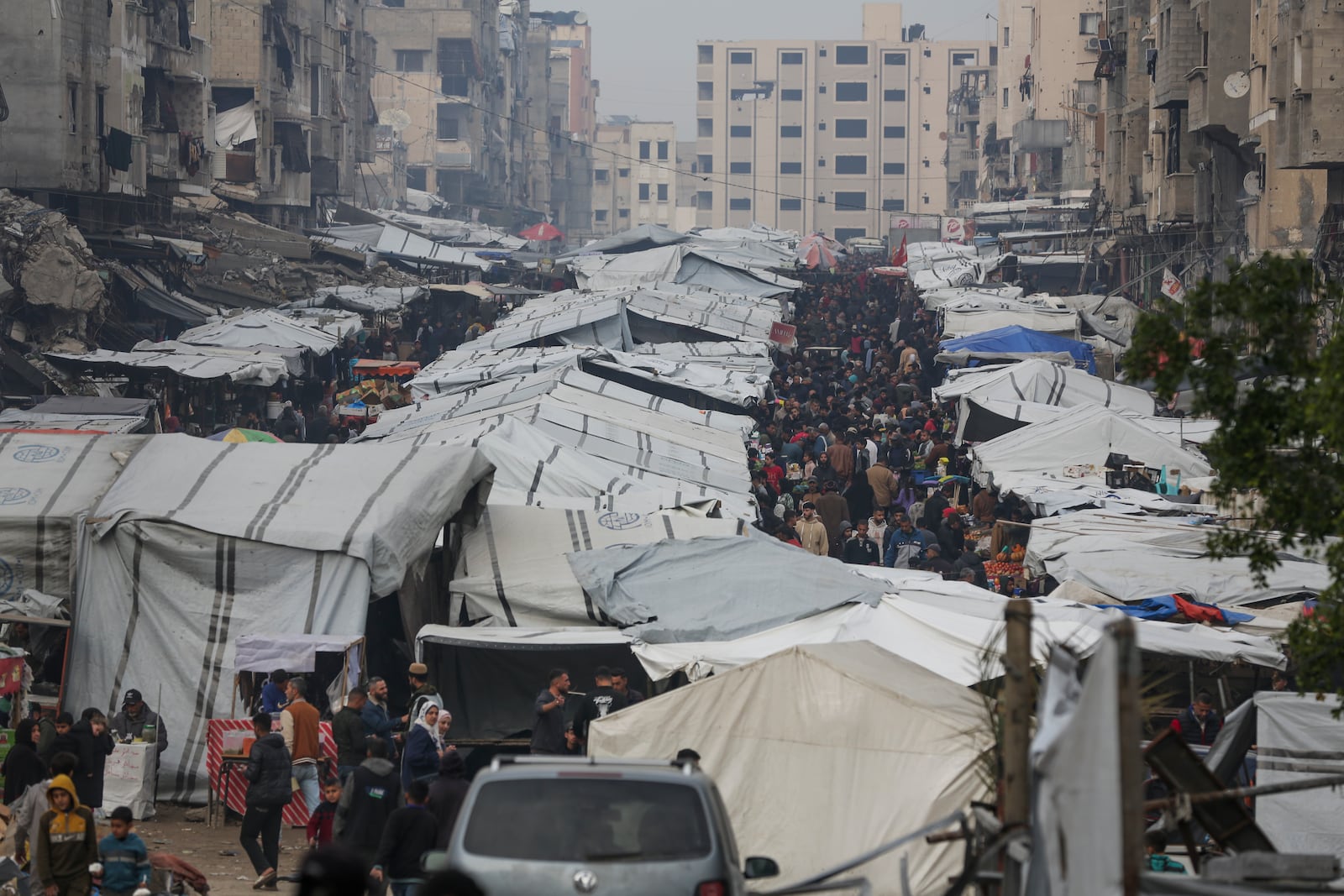 Palestinians shop at Sheikh Radwan Market, west of Gaza City, before the Iftar, the fast-breaking meal, during the holy month of Ramadan on Monday, March 3, 2025. (AP Photo/Jehad Alshrafi)