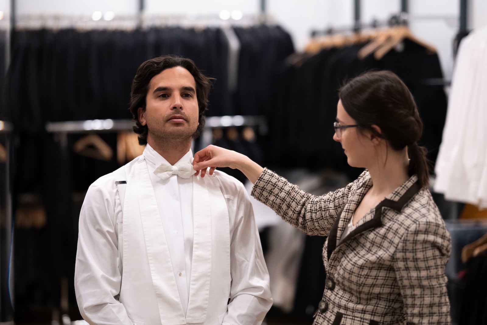 A man tries on his tailcoat before renting from Lambert Hofer, a renowned costume workshop in Vienna, Austria, Wednesday, Febr 26, 2025. (AP Photo/Denes Erdos)