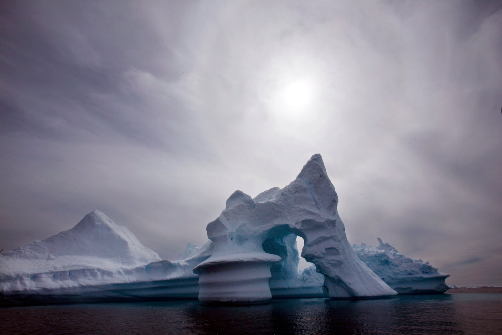 FILE - This is a July 19, 2007 file photo of an iceberg as it melts off Ammassalik Island in Eastern Greenland. (AP Photo/John McConnico, file)