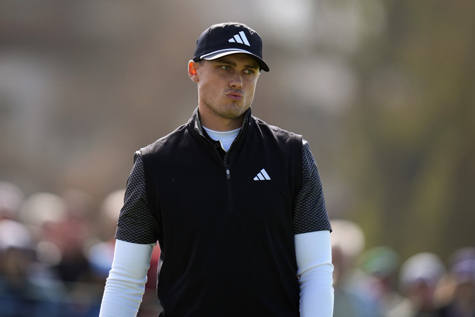 Ludvig Aberg, of Sweden, reacts to a putt on the 13th green of the South Course at Torrey Pines during the second round of the Genesis Invitational golf tournament Friday, Feb. 14, 2025, in San Diego. (AP Photo/Gregory Bull)