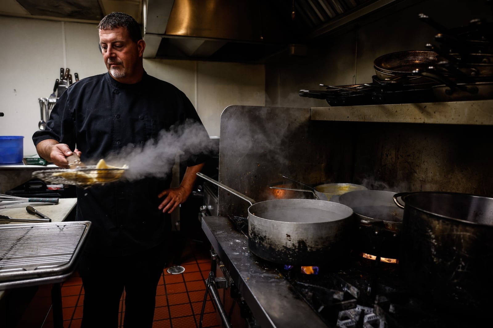 Amber Rose Restaurant & Catering chef, Luke Henry cooks pierogies in the kitchen Friday July 23, 2021. JIM NOELKER/STAFF