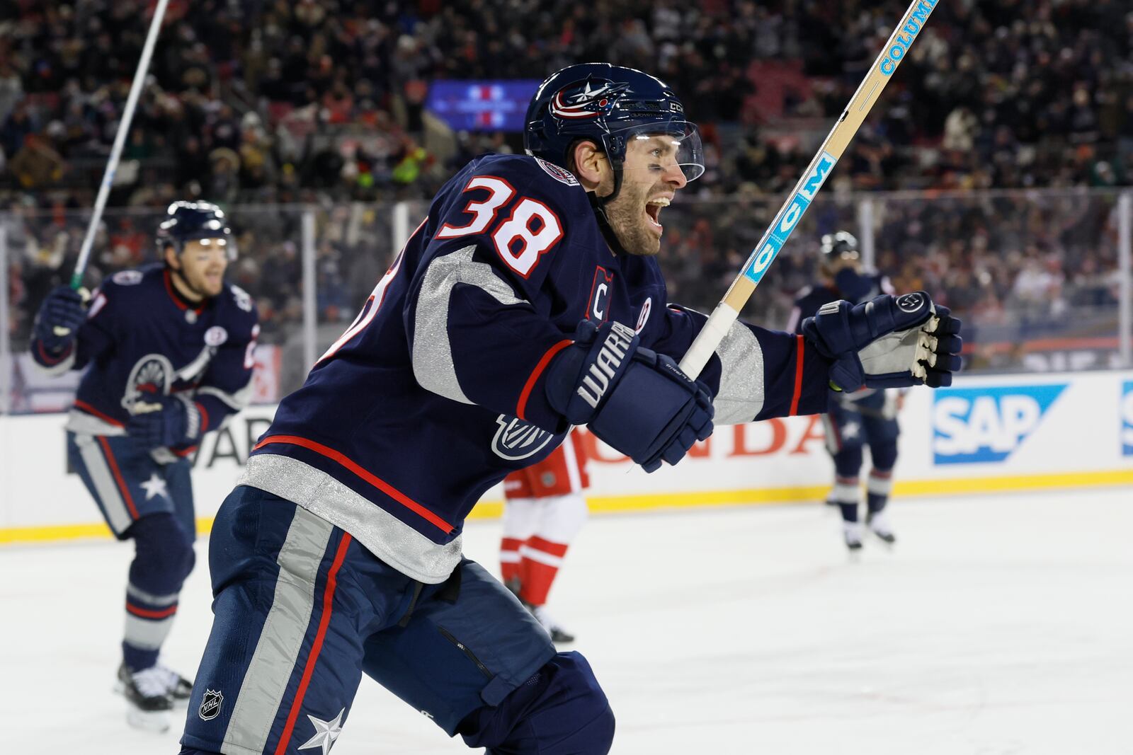 Columbus Blue Jackets' Boone Jenner celebrates their goal against the Detroit Red Wings during the second period of the Stadium Series NHL hockey game at Ohio Stadium, Saturday, March 1, 2025, in Columbus, Ohio. (AP Photo/Jay LaPrete)