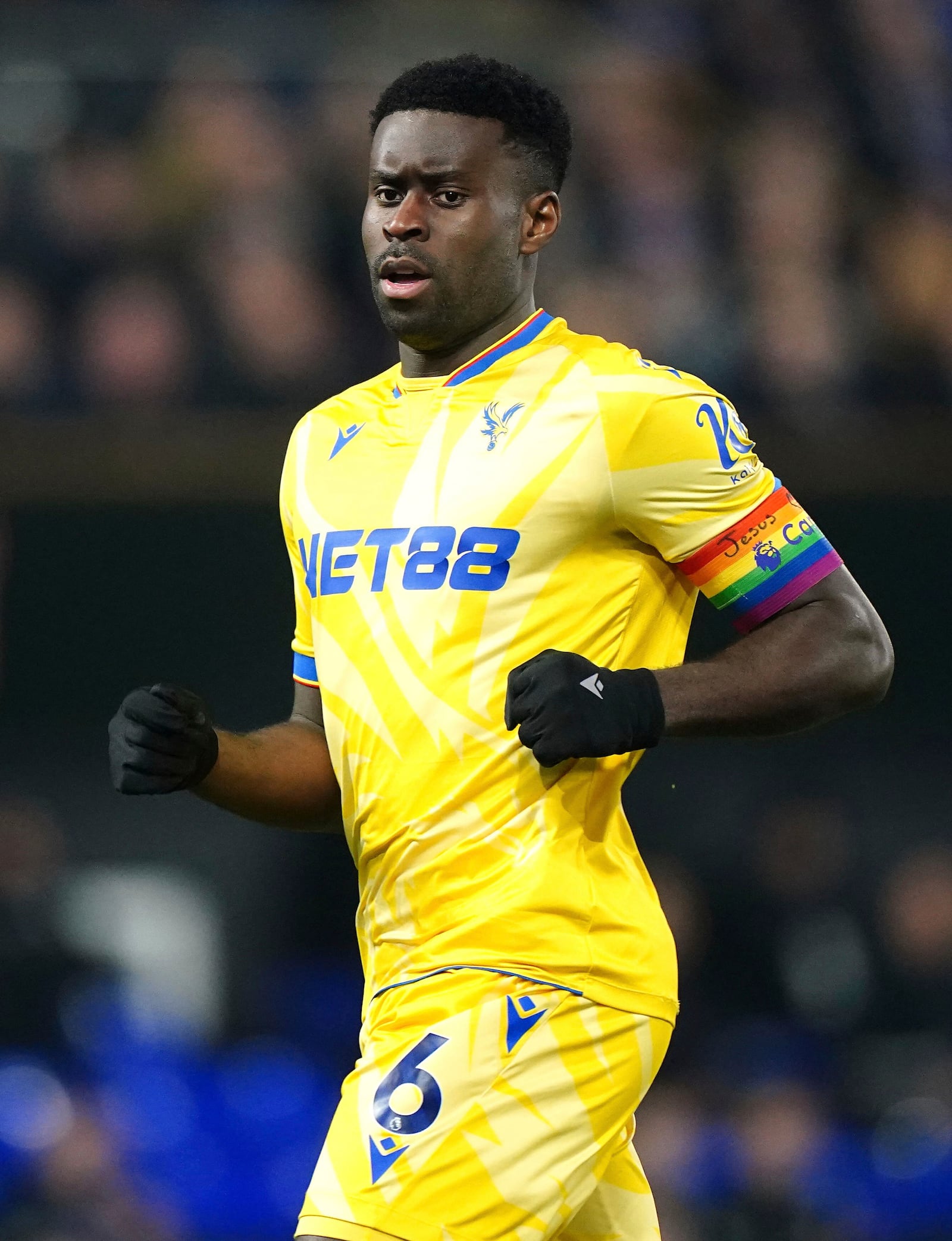 Crystal Palace's Marc Guehi wears the Rainbow Laces captain's armband which has the words 'Jesus Heart You' on during the England Premier League soccer match between Ipswich Town and Crystal Palace at Portman Road, Ipswich, England, Tuesday, Dec. 3, 2024. (Zac Goodwin/PA via AP)