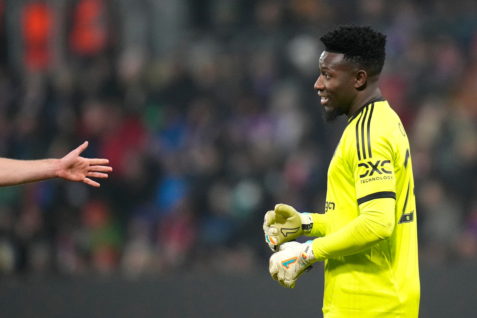 Manchester United's goalkeeper Andre Onana reacts during the Europa League soccer match between Viktoria Plzen and Manchester United at the Doosan Arena in Plzen, Czech Republic, Thursday, Dec. 12, 2024. (AP Photo/Petr David Josek)