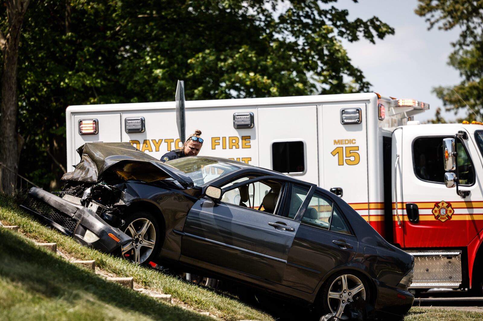 The driver of a gray Lexus fled a traffic stop and then intentionally rammed a Dayton officer's cruiser, which led to a police pursuit  in east Dayton that ended in a crash at the intersection of Murray Drive and East Fourth Street when the suspect car collided with a silver car that struck a U.S. Postal Service van.. The suspect ran but was caught by officers a couple blocks away and is in custody. Jim Noelker/Staff