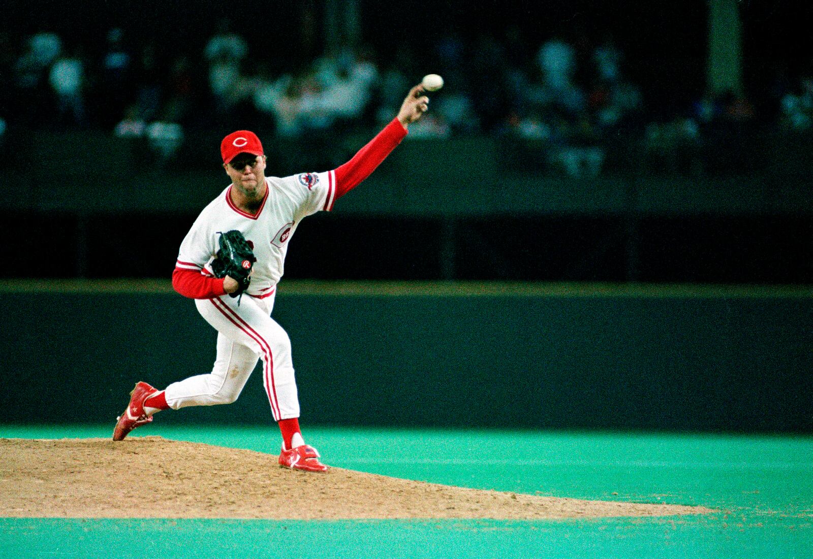 FILE - Cincinnati Reds pitcher Tom Browning delivers a pitch during a game against the Los Angeles Dodgers at Riverfront Stadium in Cincinnati, Sept. 16, 1988. Browning threw a perfect game as the Reds won 1-0. Browning, an All-Star pitcher who threw the only perfect game in Cincinnati Reds history and helped them win a World Series title, died on Monday, Dec. 19, 2022. He was 62. (AP Photo, File)