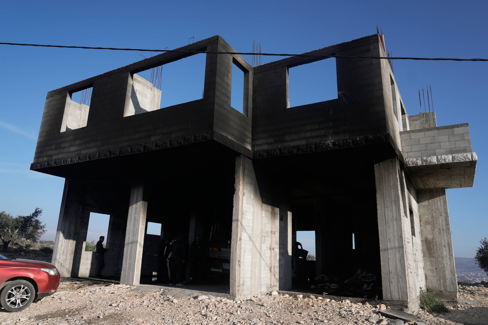 A burnt house following a settler attack that damaged vehicles and houses in the village of Beit Furik, in the occupied West Bank city of Nablus, Wednesday, Dec. 4, 2024. (AP Photo/Majdi Mohammed)