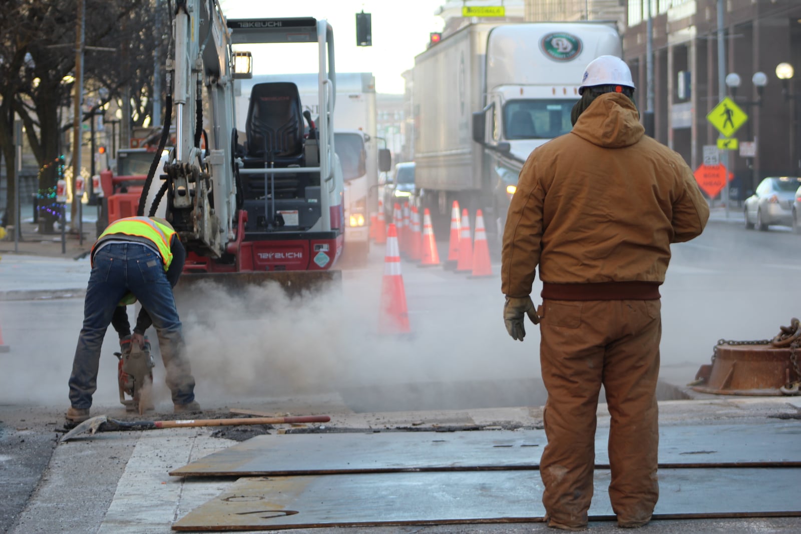 Crews work on an infrastructure project at Ludlow and West Third streets in downtown Dayton. CORNELIUS FROLIK / STAFF