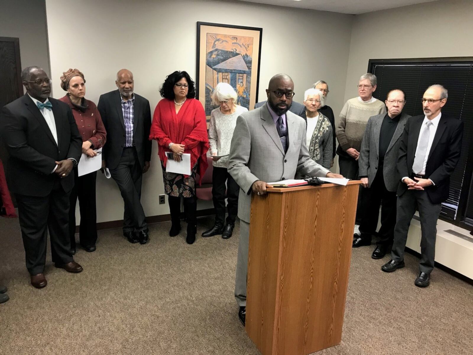 The Rev. Rockney Carter of Zion Baptist Church shares details of the expanded civil rights complaint that he and other west Dayton clergy filed against Premier Health over the closing of Good Samaritan Hospital. KAITLIN SCHROEDER