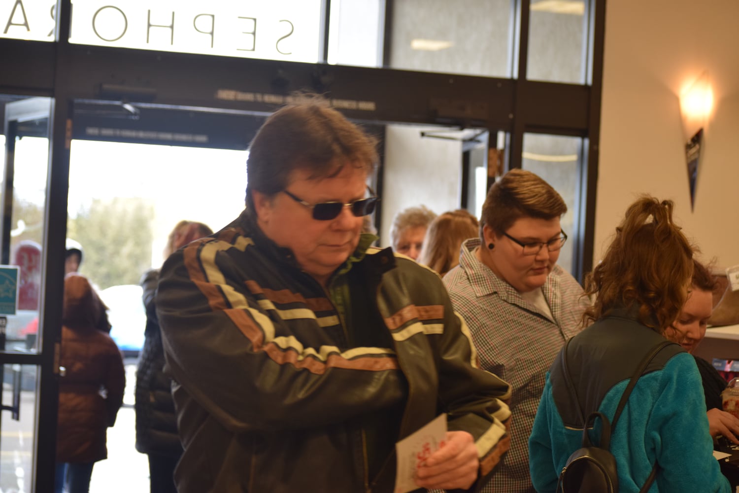 PHOTOS: Hundreds like up outside JCPenney for doorbusters, coupons