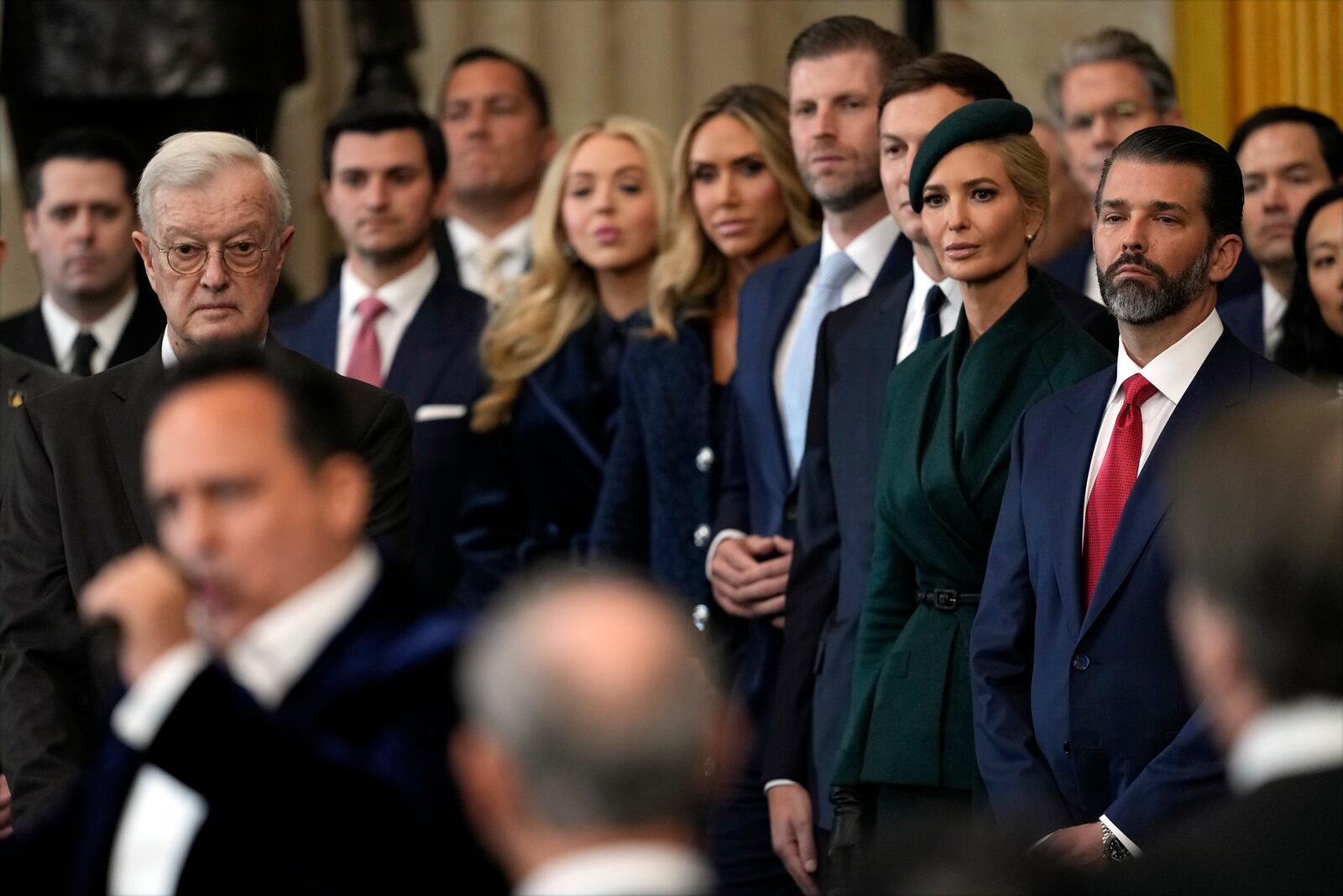 Members of the Trump family listen as Christopher Maccio sings during the 60th Presidential Inauguration in the Rotunda of the U.S. Capitol in Washington, Monday, Jan. 20, 2025. (AP Photo/Julia Demaree Nikhinson, Pool)