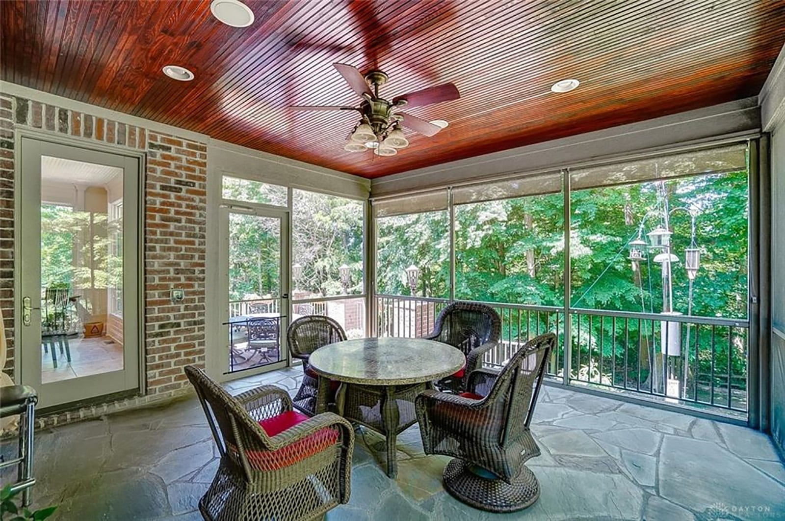 The 3-season room has a stone-stamped floor and wood bead-board ceiling. It accessed from the breakfast room. CONTRIBUTED PHOTO BY KATHY TYLER