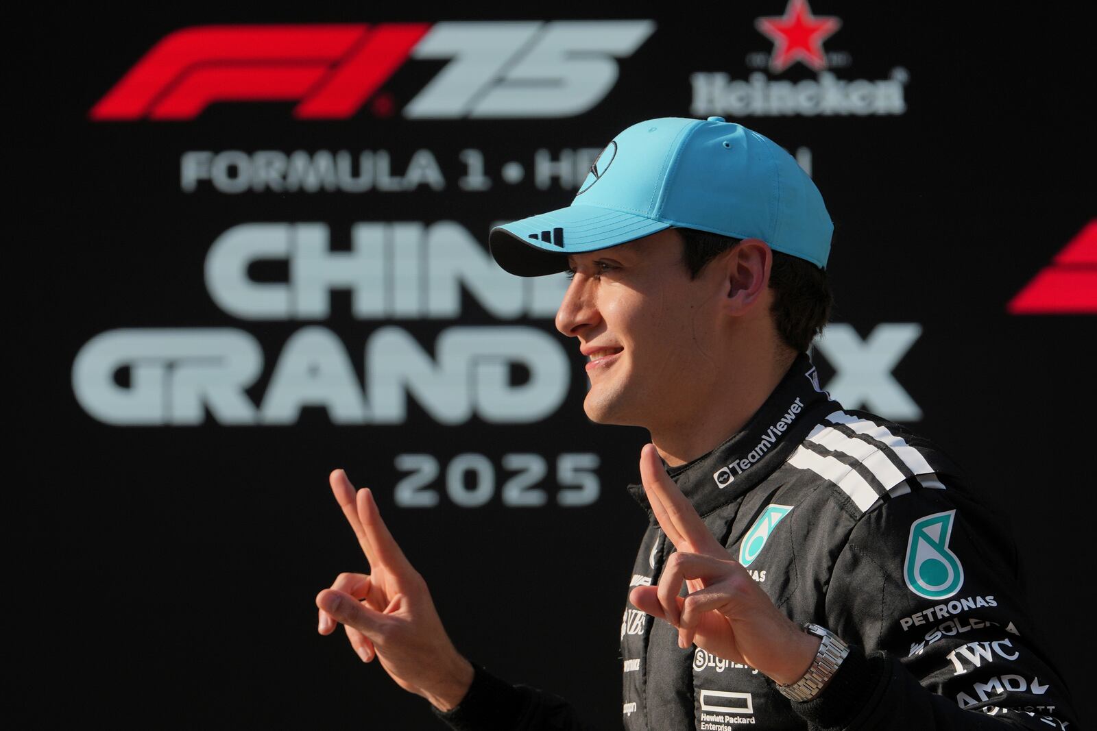 Mercedes driver George Russell of Britain poses after qualifying session for the Chinese Formula One Grand Prix at the Shanghai International Circuit, Shanghai, Saturday, March 22, 2025. (AP Photo/Andy Wong)