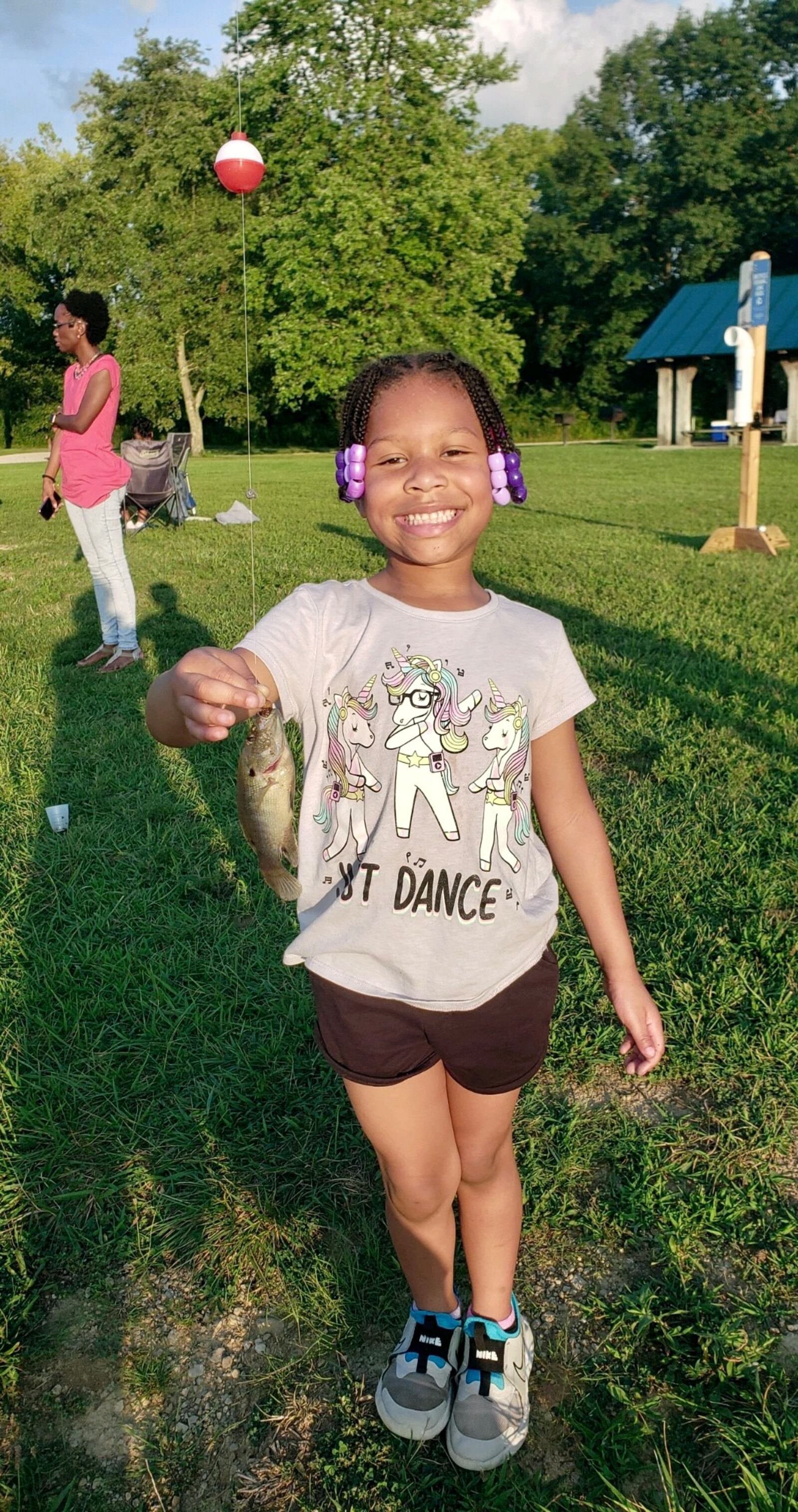 Young anglers celebrated their first big catch at the recent Adventure Central Family Fishing program. CONTRIBUTED