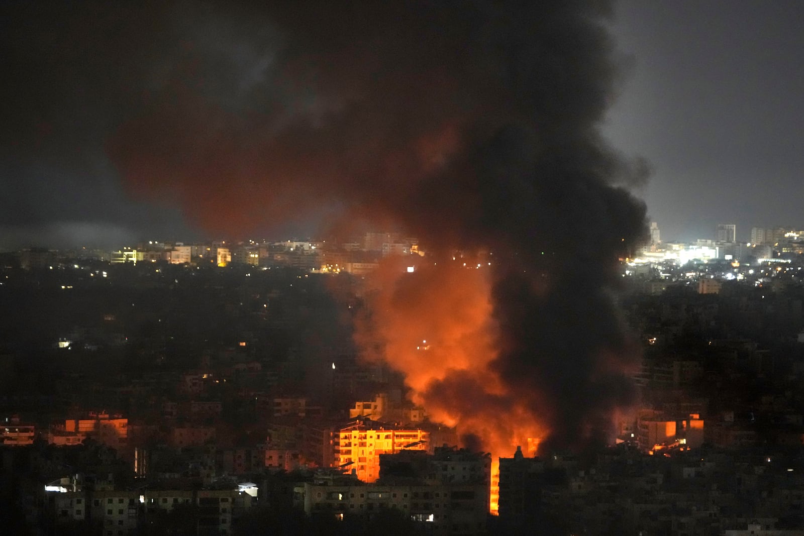 Flame and smoke rises from an Israeli airstrike on Dahiyeh, in the southern suburb of Beirut, Lebanon, early Sunday, Oct. 27, 2024. (AP Photo/Hussein Malla)