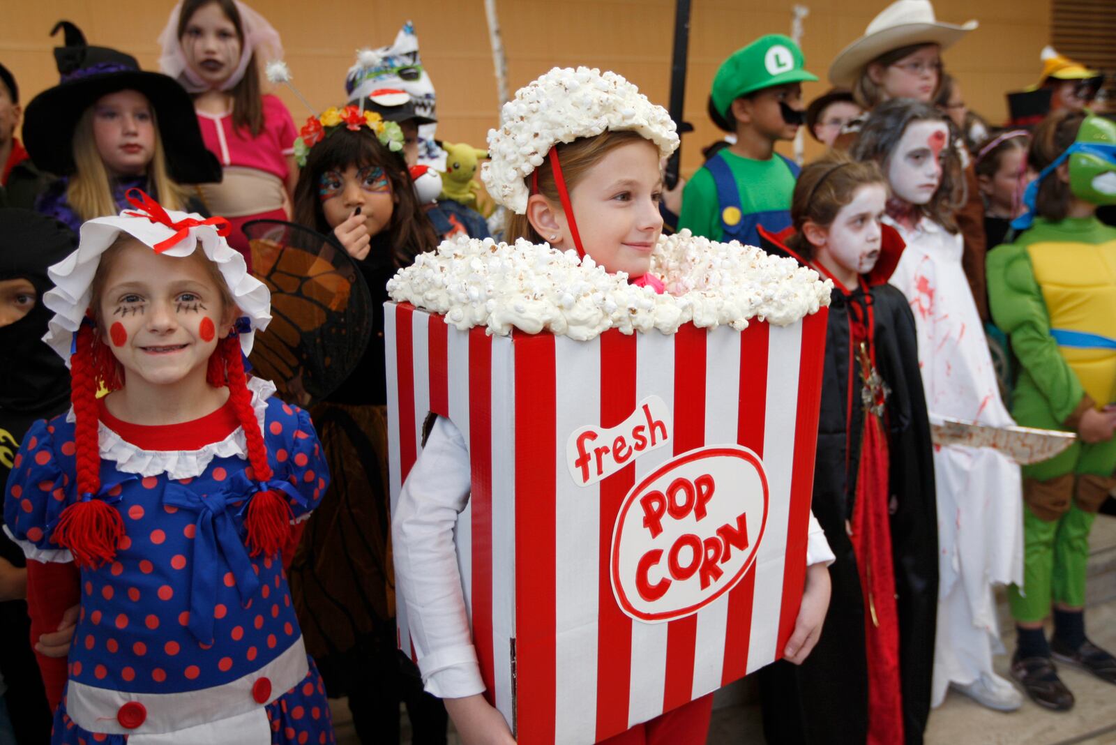 Lily Knorr, 8, (left) and Beth DeLon, 9, both of Oakwood, stand in line for judging in the costume contest before the Dayton Philharmonic Orchestra's annual PhilharMonster Concert Saturday, Oct. 30, at the Schuster Center.