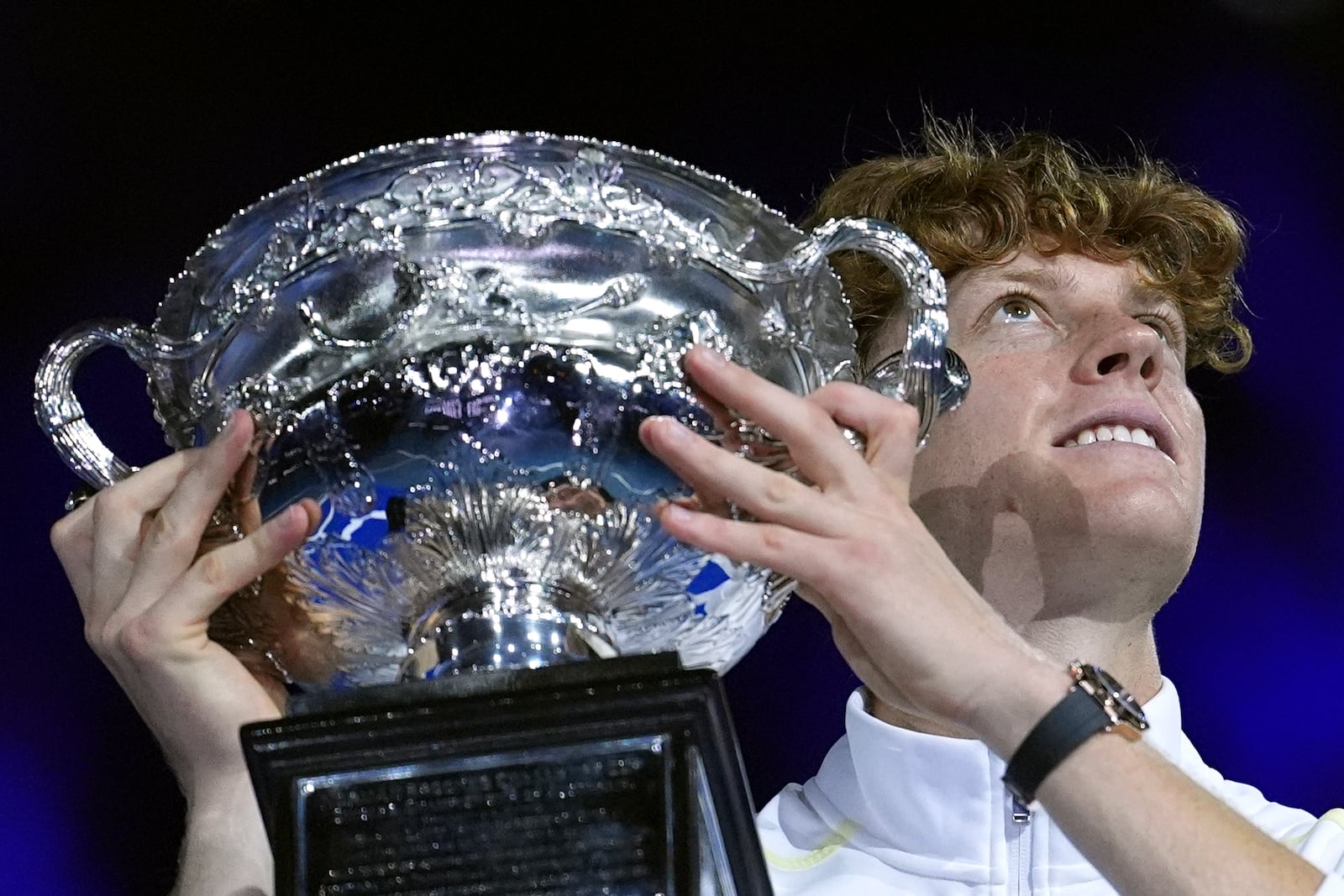 FILE -Jannik Sinner of Italy holds the Norman Brookes Challenge Cup aloft after defeating Alexander Zverev of Germany in the men's singles final at the Australian Open tennis championship in Melbourne, Australia, Jan. 26, 2025. (AP Photo/Ng Han Guan, File)