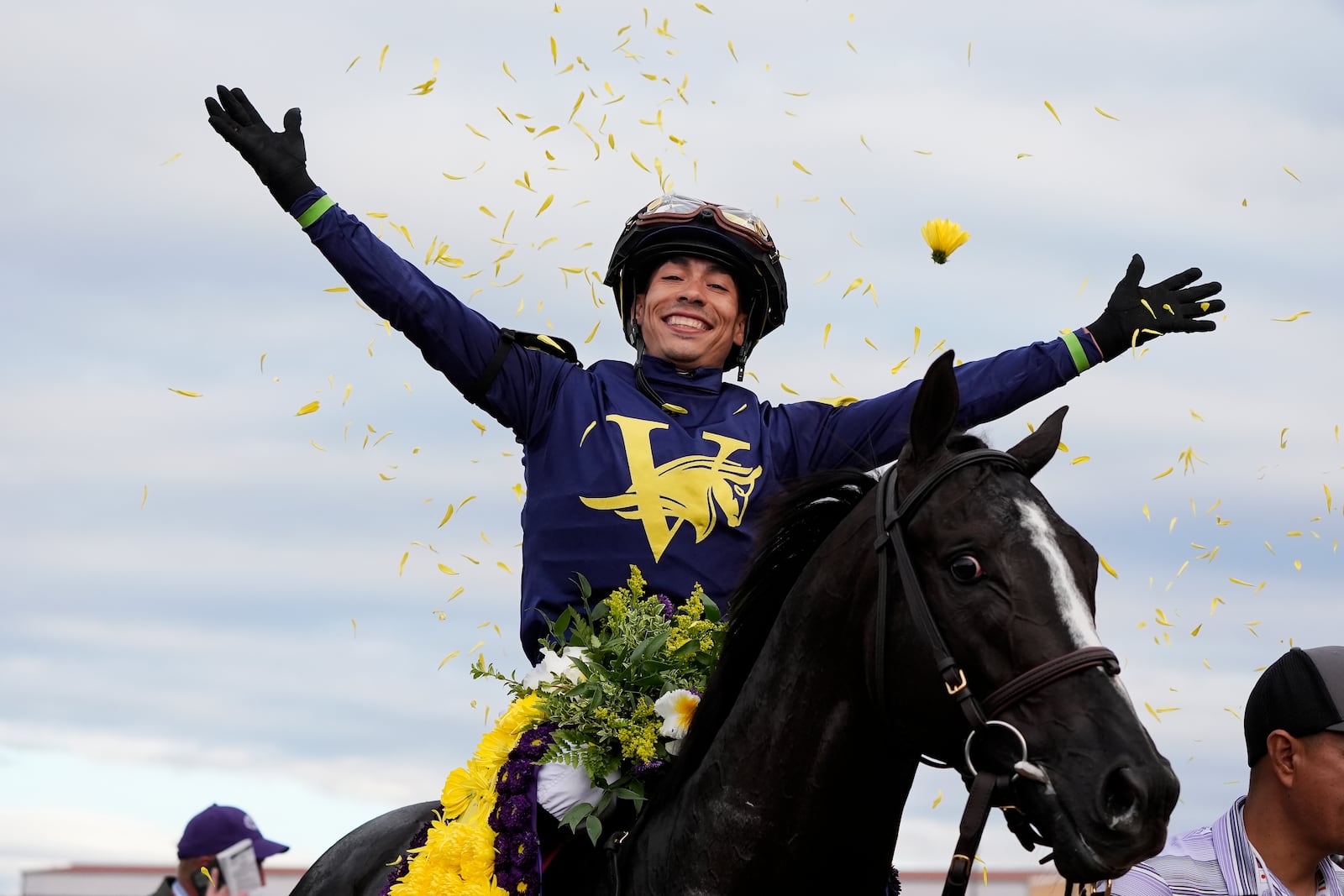 Jose Ortiz celebrates after riding More Than Looks to victory in the Breeders' Cup Mile horse race in Del Mar, Calif., Saturday, Nov. 2, 2024. (AP Photo/Gregory Bull)