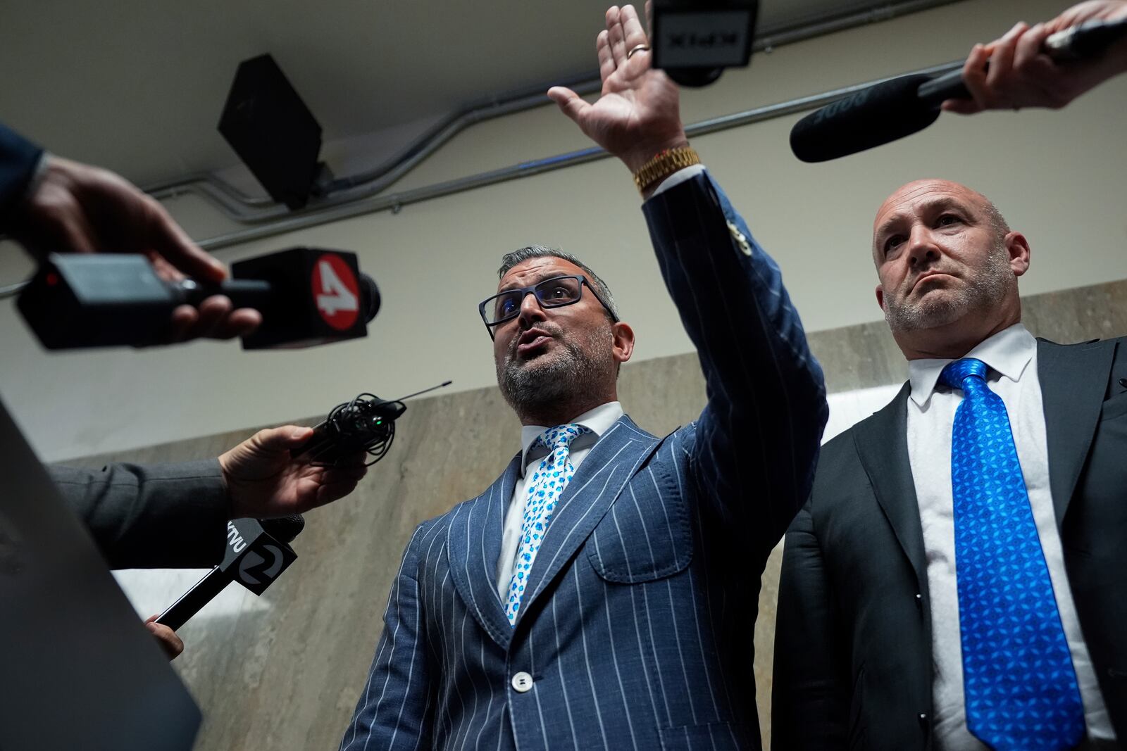 Defense attorneys Saam Zangeneh, center, and Bradford Cohen, right, speak to reporters after exiting the courtroom at the Hall of Justice for the murder trial of Nima Momeni, Tuesday, Dec. 3, 2024, in San Francisco. (AP Photo/Godofredo A. Vásquez)