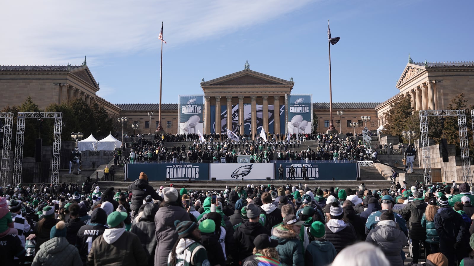 Fans listen at the base of the Philadelphia Art Museum during the Philadelphia Eagles' NFL football Super Bowl 59 parade and celebration, Friday, Feb. 14, 2025, in Philadelphia. (AP Photo/Chris Szagola)