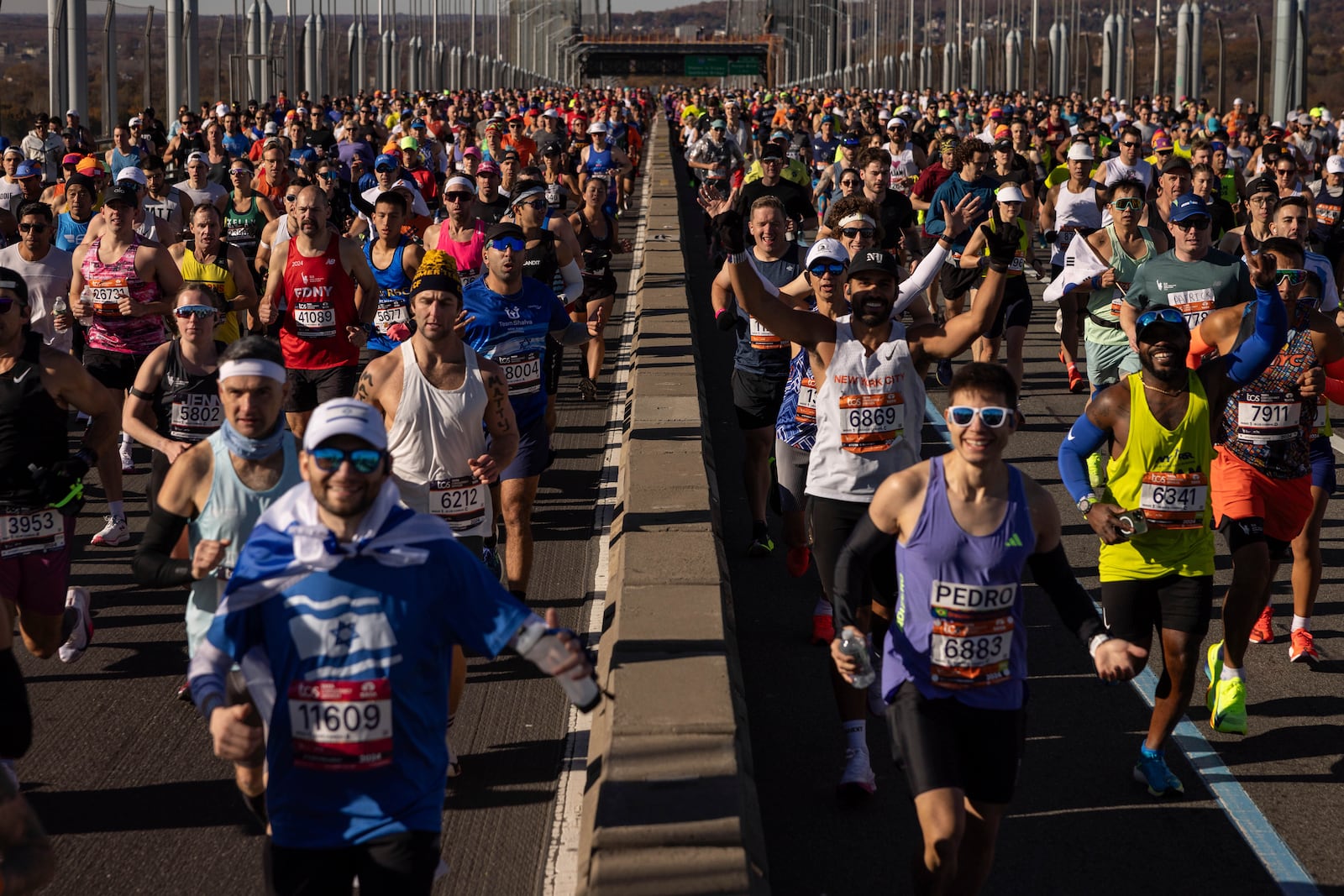 Runners cross the Verrazzano-Narrows Bridge at the start of the New York City Marathon, Sunday, Nov. 3, 2024, in New York. (AP Photo/Yuki Iwamura)