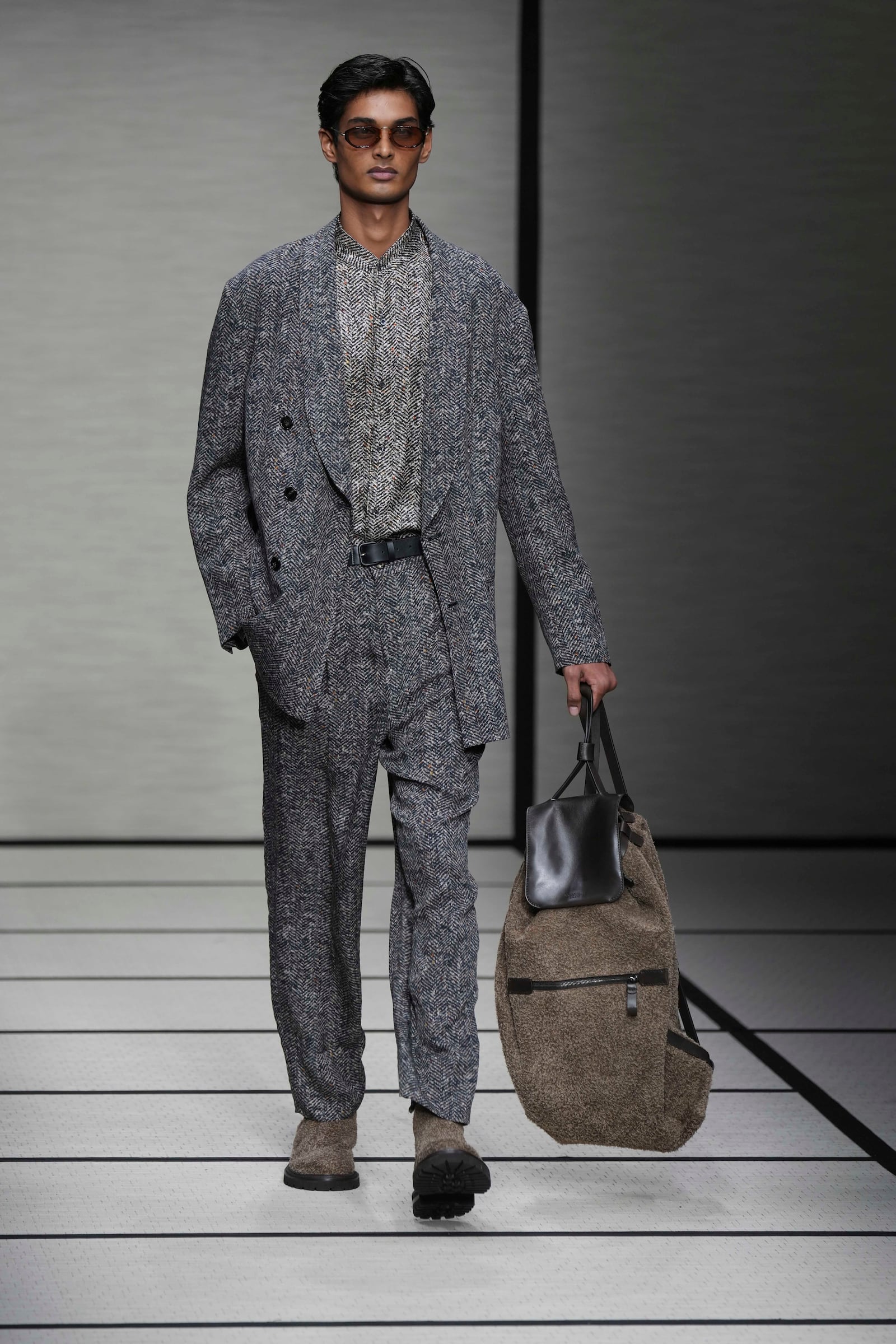 A model wears a creation part of the men's Giorgio Armani Fall-Winter 2025-2026 collection, that was presented in Milan, Italy, Monday, Jan. 20, 2025. (AP Photo/Antonio Calanni)