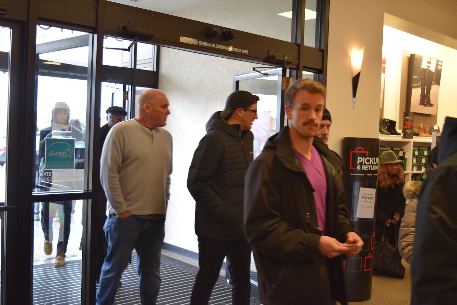 PHOTOS: Hundreds like up outside JCPenney for doorbusters, coupons