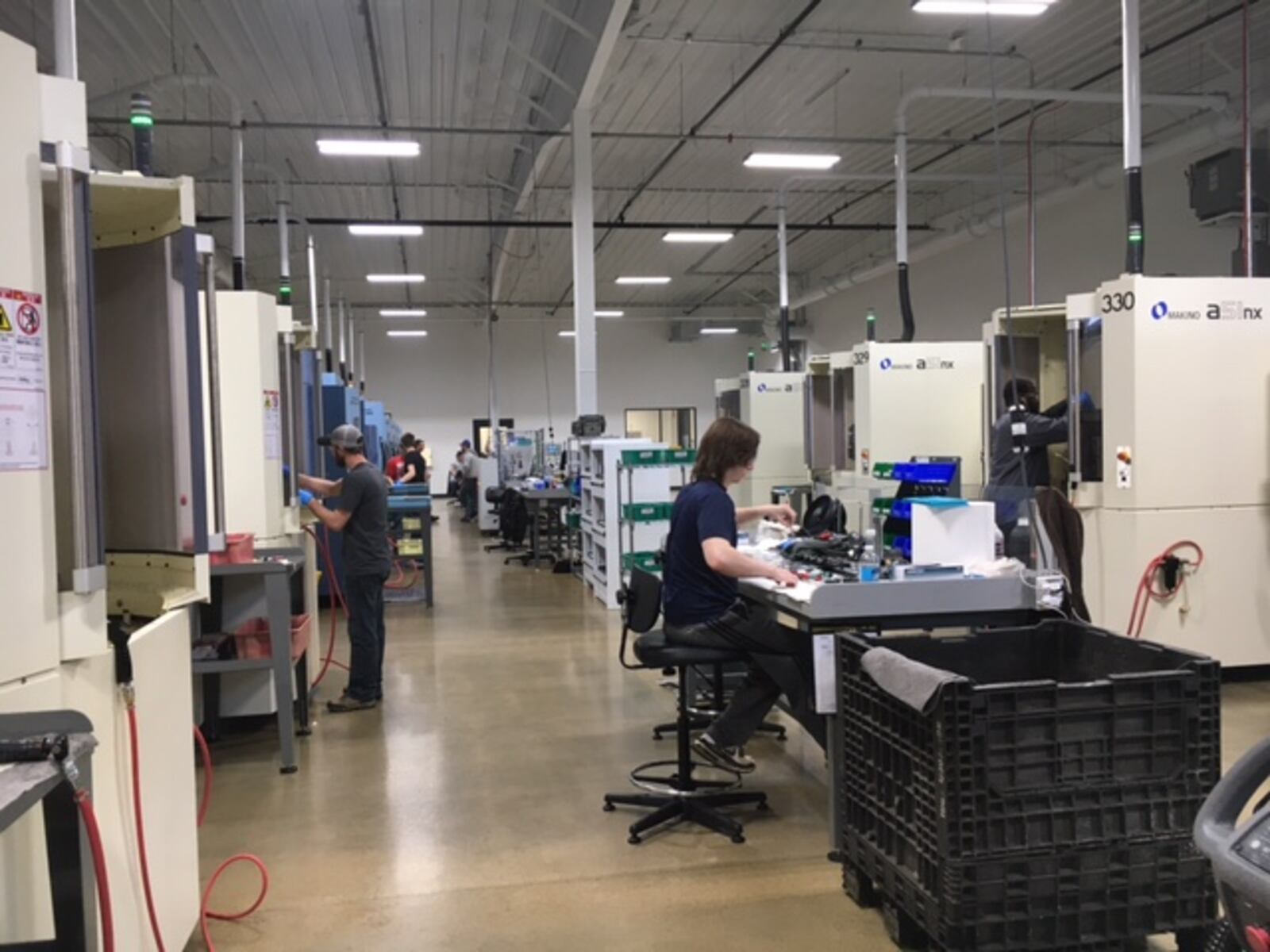 Employees at Norwood Medical in Dayton kept rows of CNC (computer numeric controlled) machines busy on a recent afternoon. THOMAS GNAU/STAFF