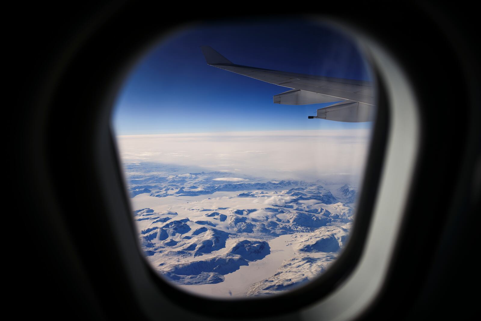 Greenland is viewed from a Royal Canadian Airforce plane carrying the Canadian Prime Minister as he makes his way to Iqaluit, Nunavut on Tuesday, March 18, 2025. (Sean Kilpatrick/The Canadian Press via AP)