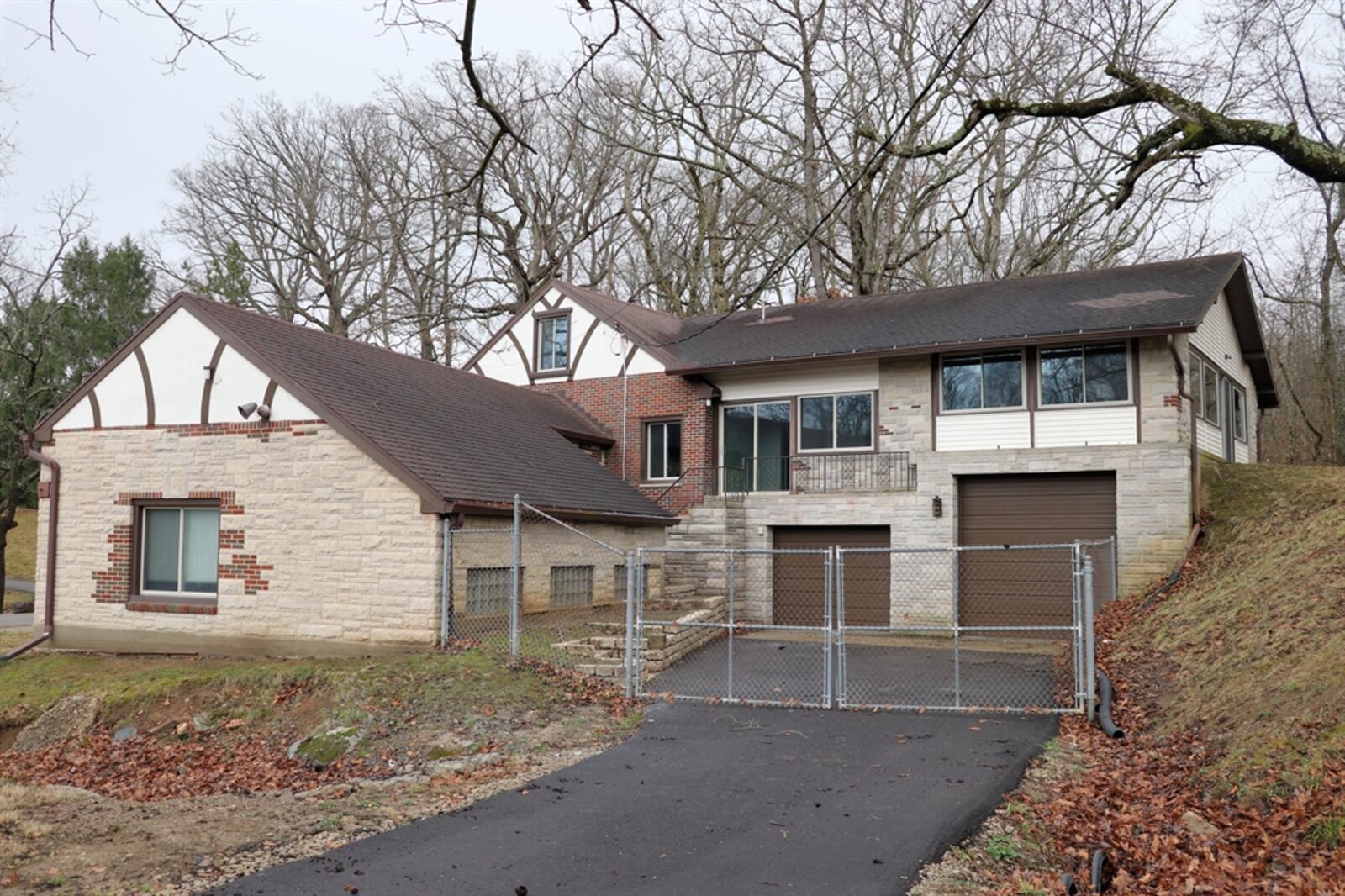 The brick home at 8956 Adams Road has about 2,468 square feet of living space with flexible rooms and unfinished storage options.