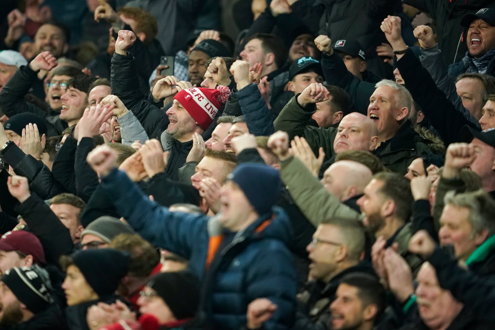 Soccer fans react during the English Premier League soccer match between Everton and Liverpool, Liverpool, England, Wednesday, Feb.12, 2025. (AP Photo/Dave Thompson)