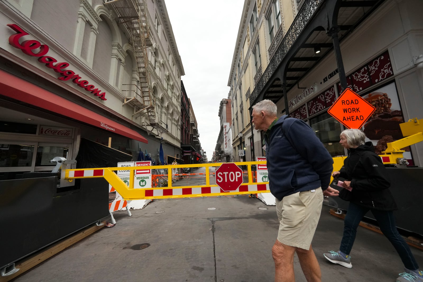 Newly installed security barriers are seen on Bourbon Street next to a memorial for victims of the Jan. 1 car attack ahead of the Super Bowl in New Orleans, Friday, Jan. 31, 2025. (AP Photo/Gerald Herbert)