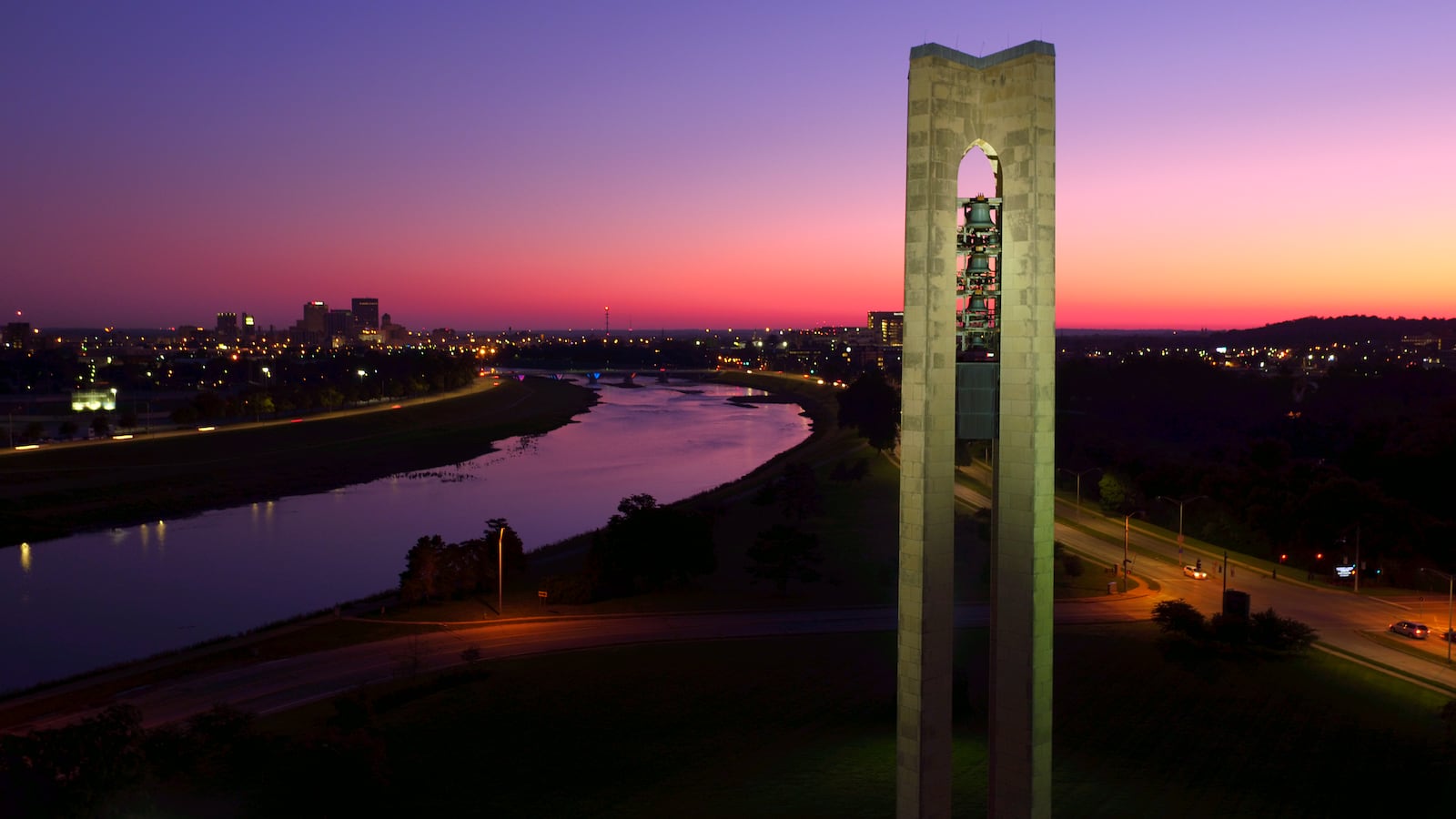 The Dayton skyline can be seen beyond the Deeds Carillon as the sun rises over the city on  Aug. 24, 2018. JAROD THRUSH / STAFF