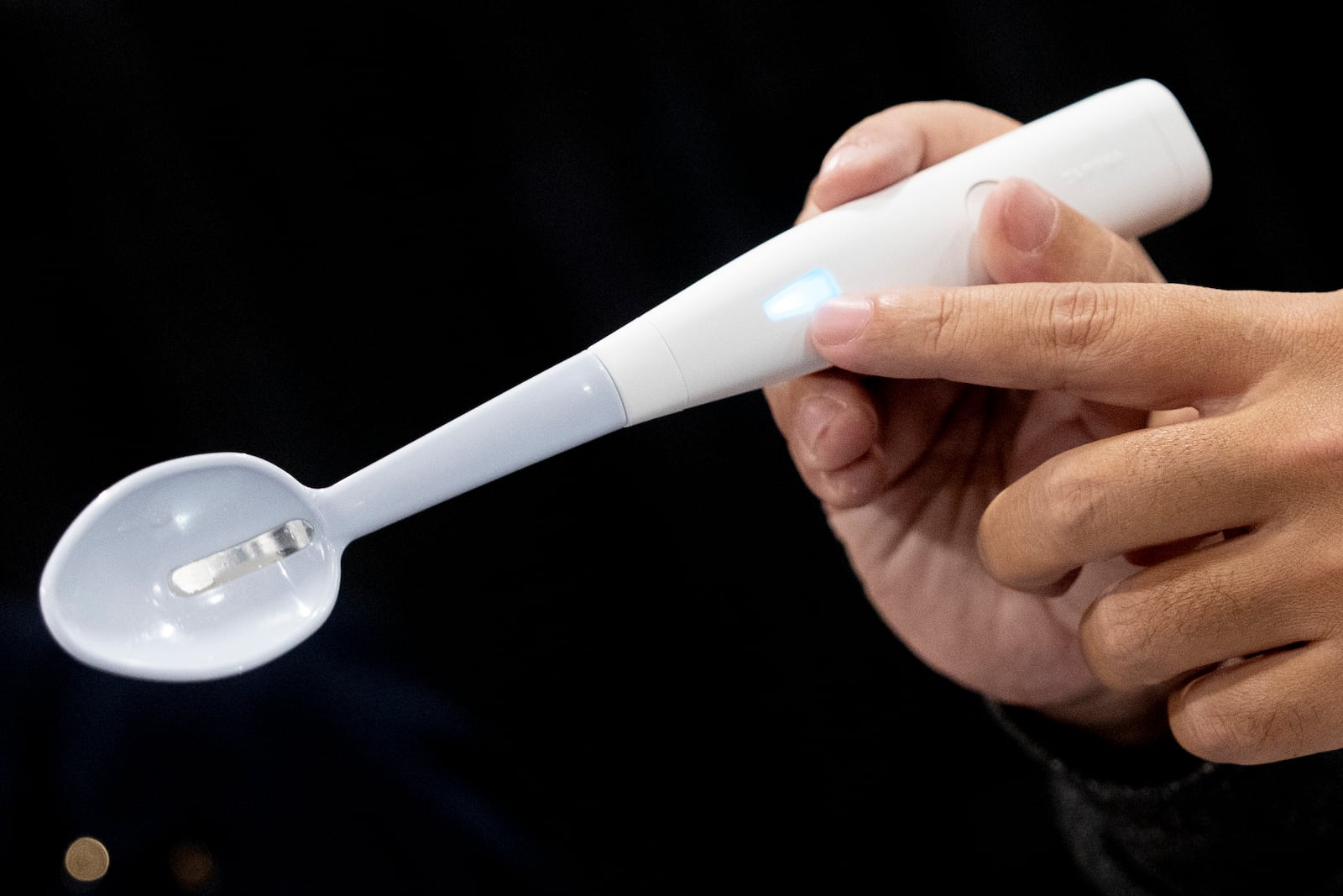 The Kirin Electric Salt spoon flows a mild electric current through the food around the tongue to attract salt towards the tongue creating a more intense salt flavor, during 2025 CES Unveiled, Sunday, Jan. 5, 2025, in Las Vegas. (AP Photo/Jack Dempsey)