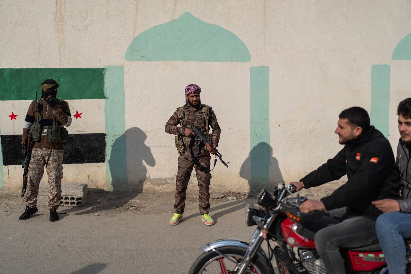 Security members of the new Syrian government stand guard outside the shrine of Sayyida Zaynab, the granddaughter of Prophet Mohammed, in Damascus, Syria, Saturday, Jan. 11, 2025. (AP Photo/Mosa'ab Elshamy)