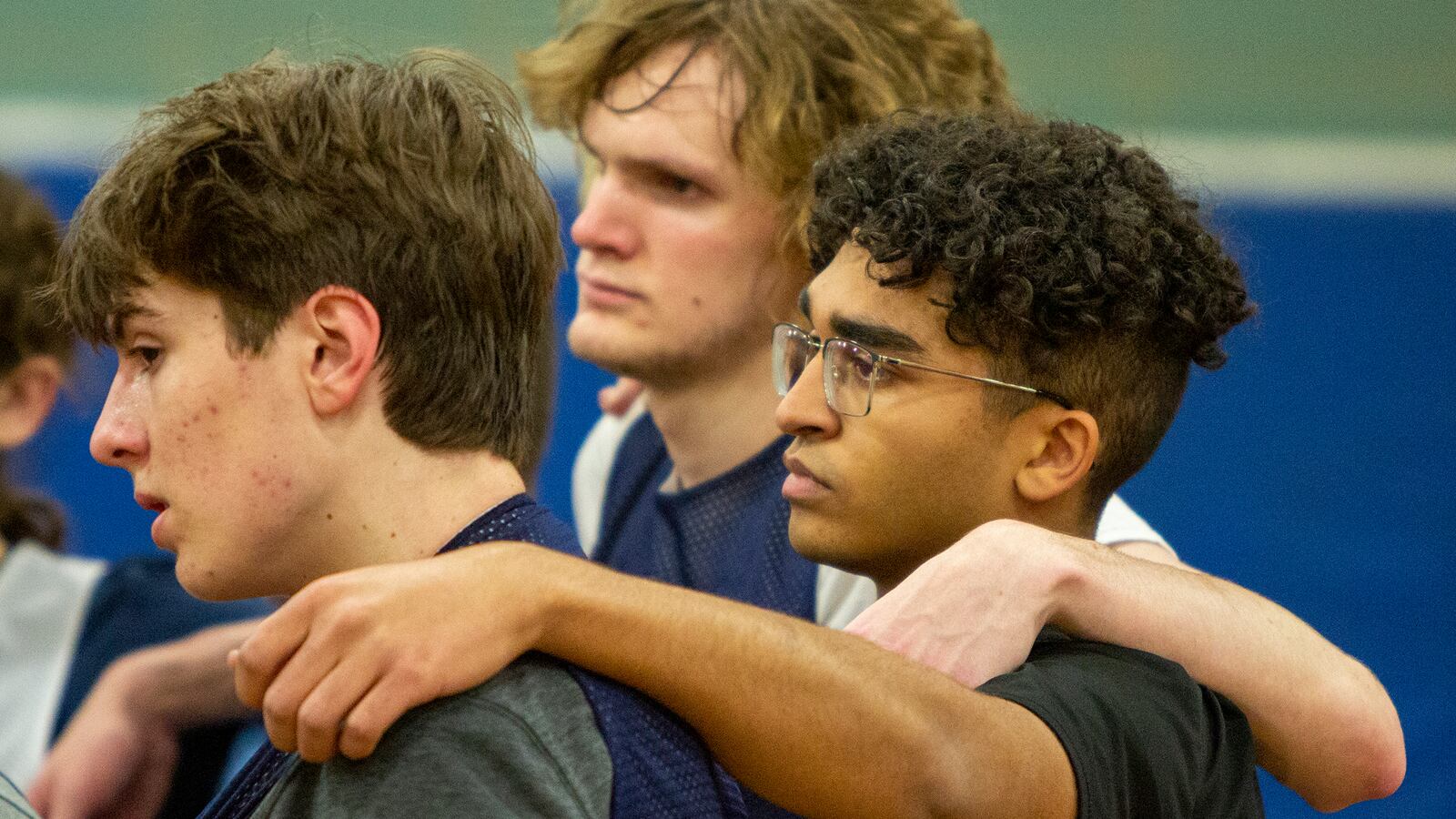 Fairmont student coach Jordan Harbeck (center) joins in with players during a team huddle at the end of a recent practice. Jeff Gilbert/CONTRIBUTED