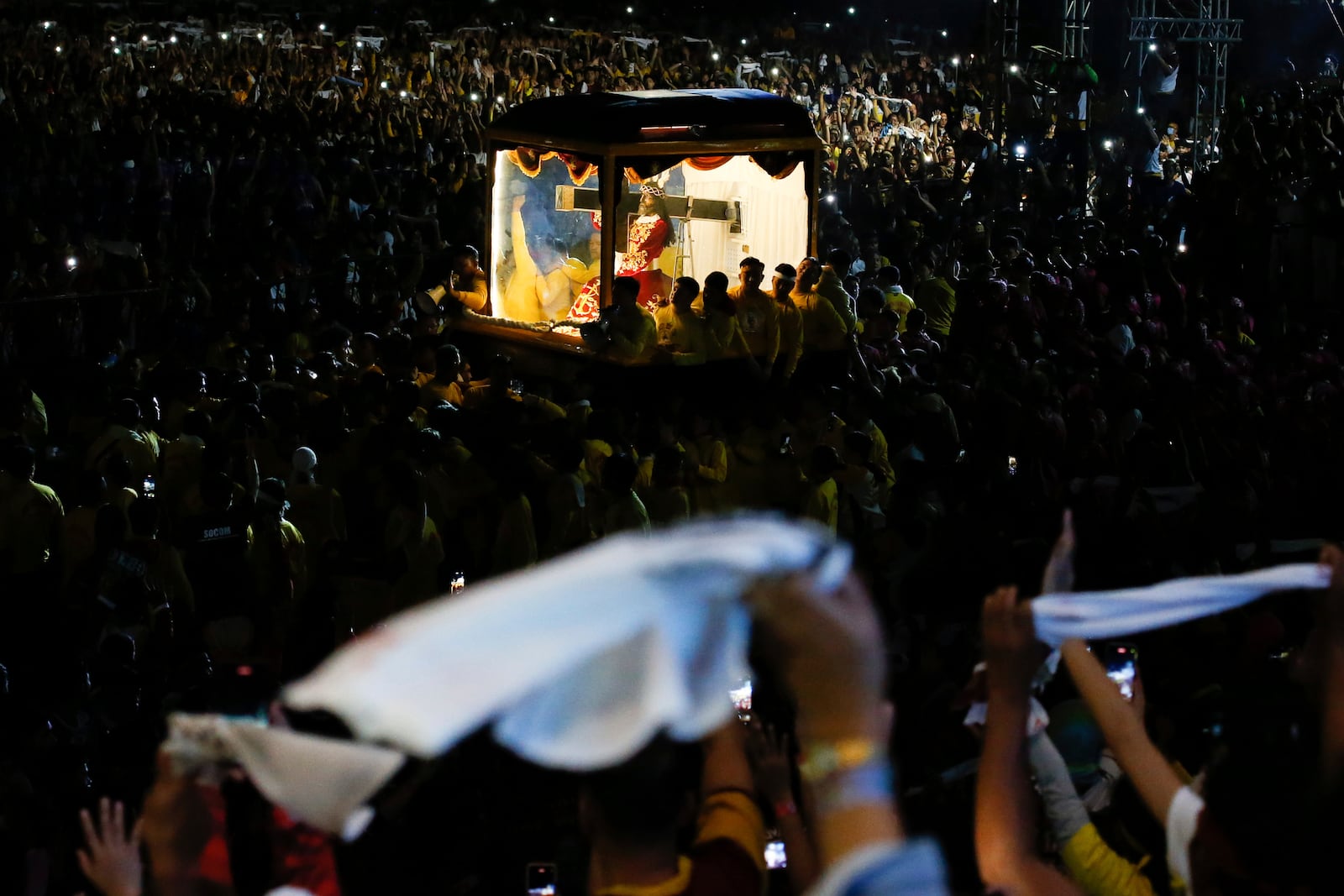 Devotees pull a glass-covered carriage carrying the image of Jesus Nazareno during its annual procession in Manila, Philippines, Thursday. Jan. 9, 2025. (AP Photo/Basilio Sepe)