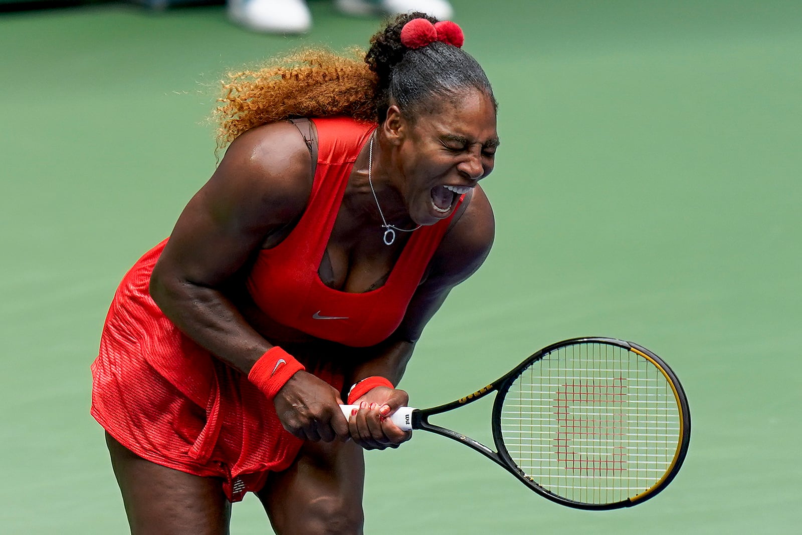 Serena Williams, of the United States, reacts during a match against Tsvetana Pironkova, of Bulgaria, during the quarterfinals of the US Open tennis championships, Wednesday, Sept. 9, 2020, in New York. (AP Photo/Seth Wenig)