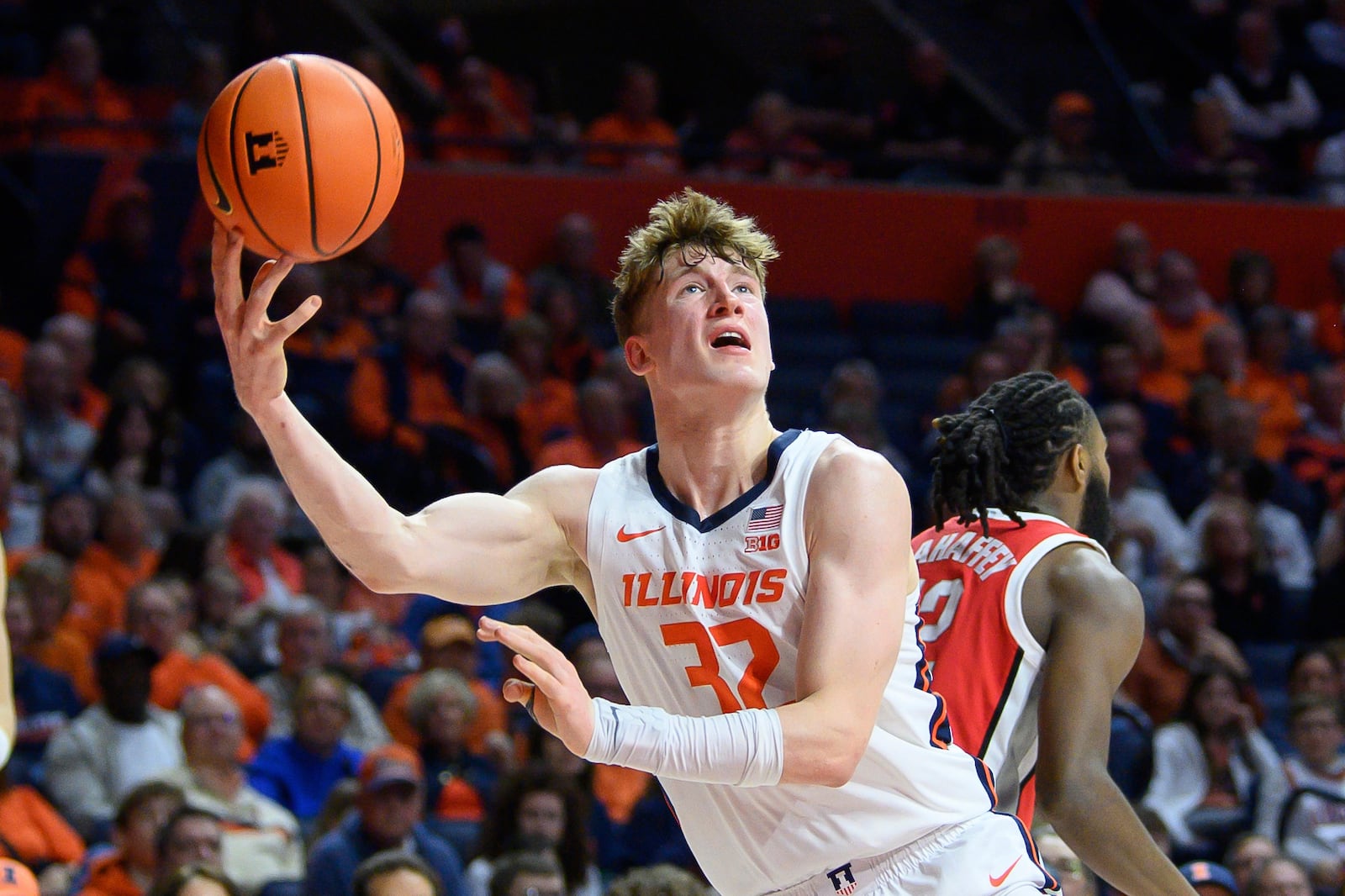 Illinois' Kasparas Jakucionis takes an off balance shot during the first half of an NCAA college basketball game against Ohio State, Sunday, Feb. 2, 2025, in Champaign, Ill. (AP Photo/Craig Pessman)