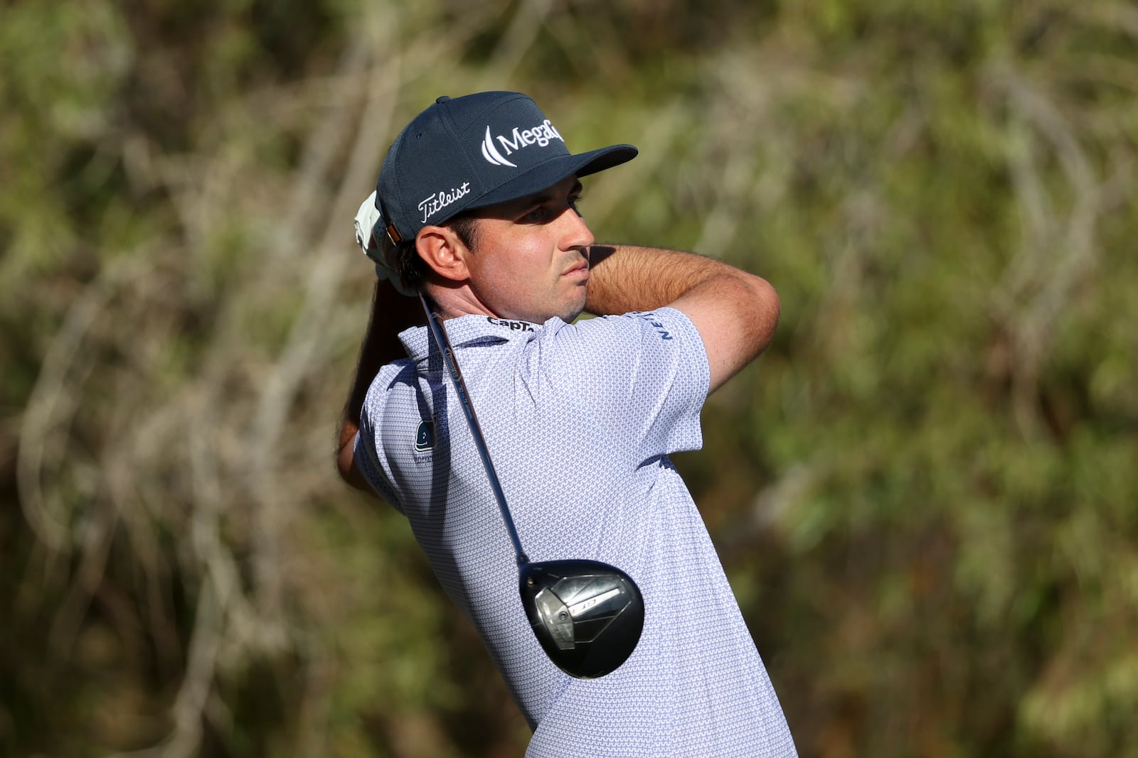 J.T. Poston hits off the tee on the 13th hole during the final round of the Shriners Children's Open golf tournament, Sunday, Oct. 20, 2024, in Las Vegas. (AP Photo/Ian Maule)