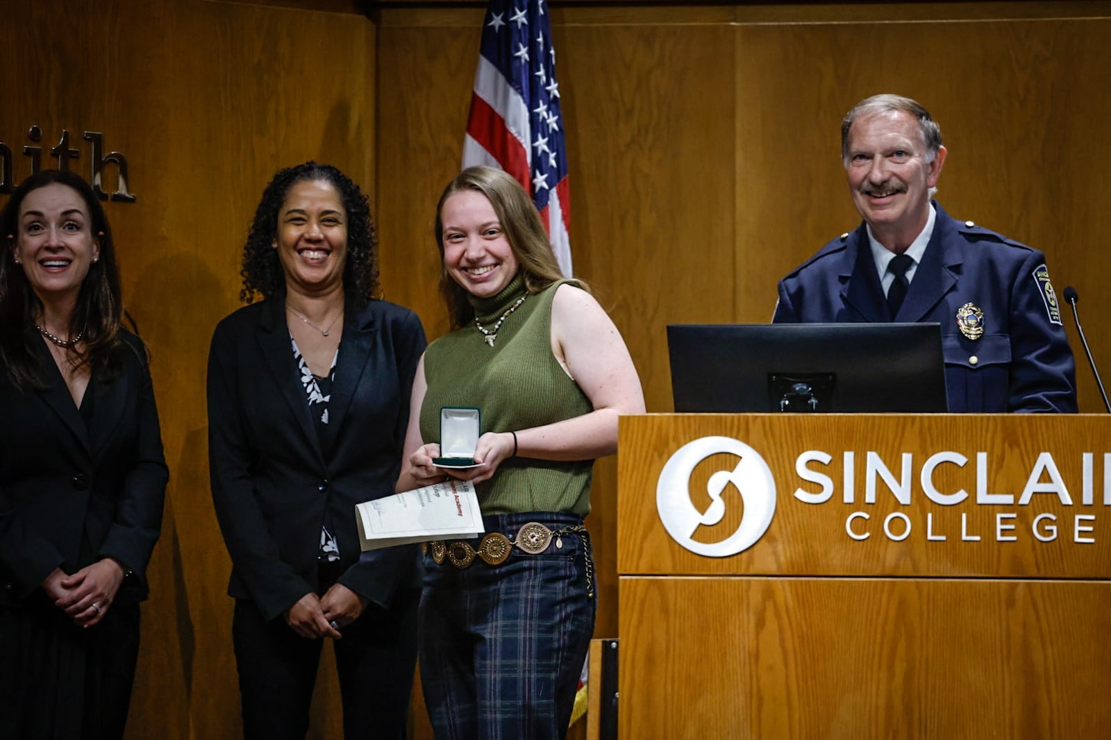 Dayton Daily News reporter London Bishop received special recognition for reporting on and participating in the Sinclair College Criminal Justice Training Academy on Wednesday evening June 12, 2024, at the graduation ceremony held at Sinclair College. JIM NOELKER/STAFF